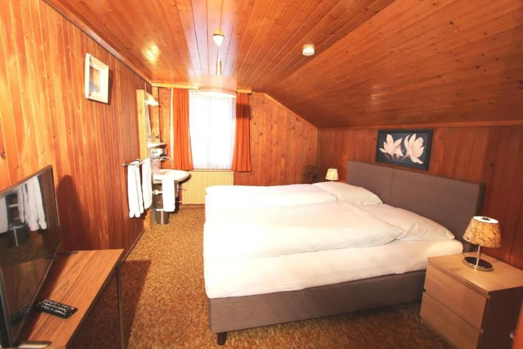 Bed in Hotel-Restaurant Alpina