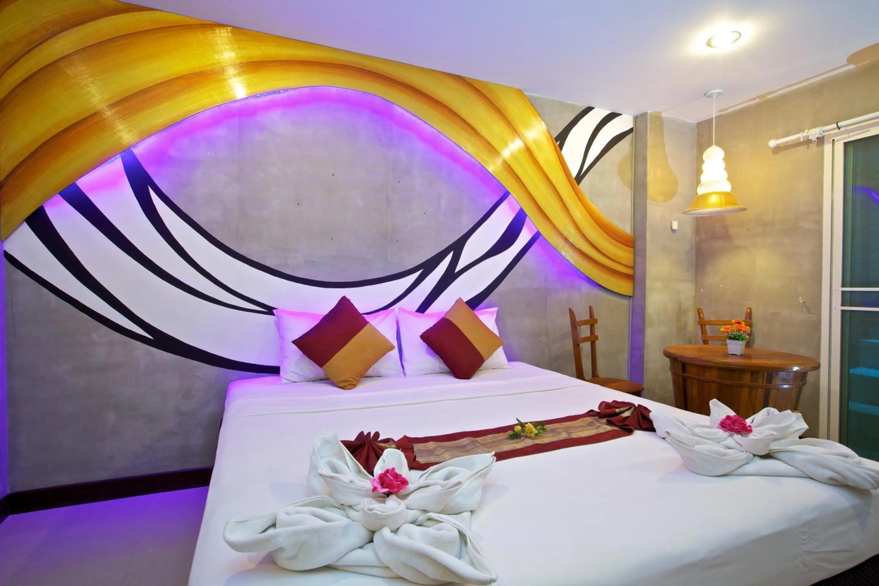 Bed in Baan Kamala Fantasea Hotel