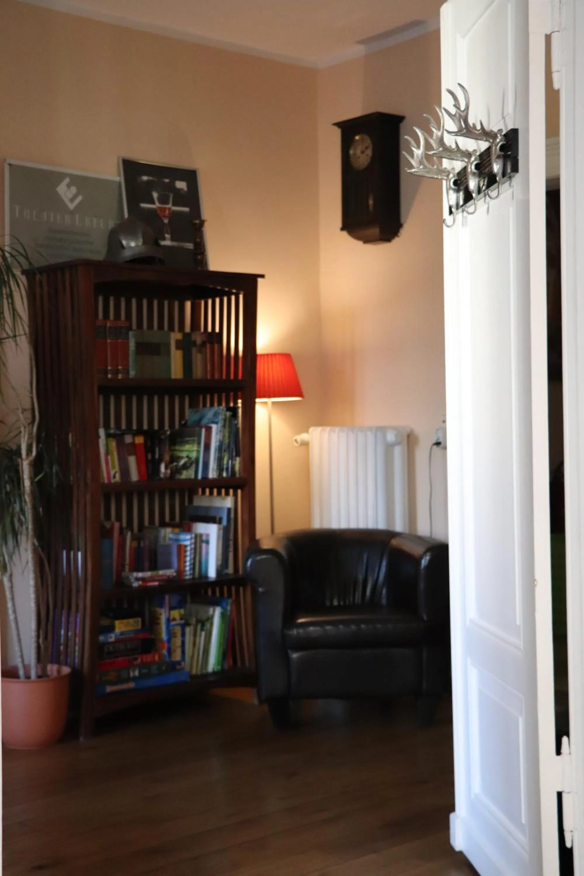 Communal lounge/ TV room in OPERA Hostel