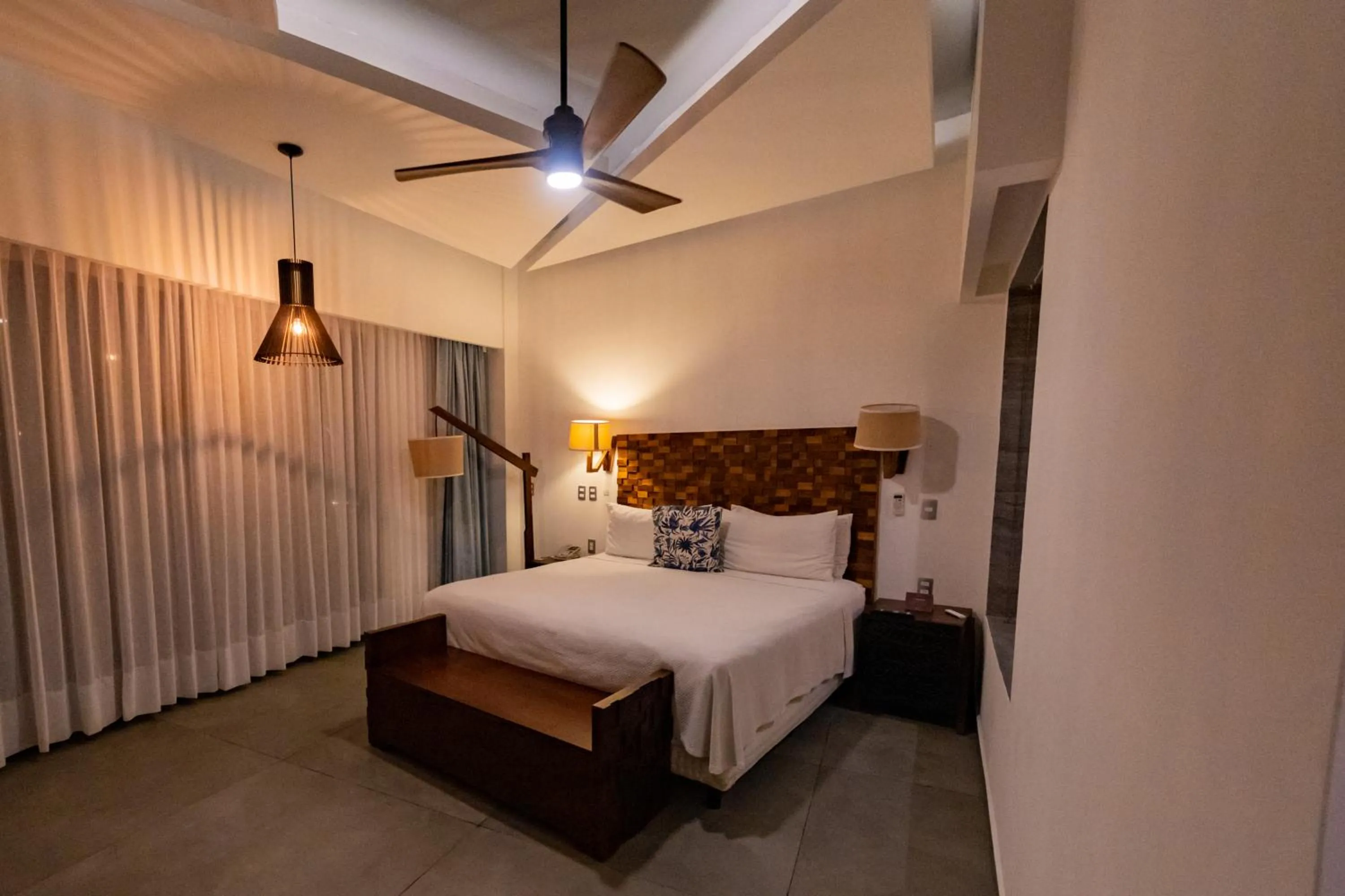 Bed in Mia Bacalar Luxury Resort & Spa