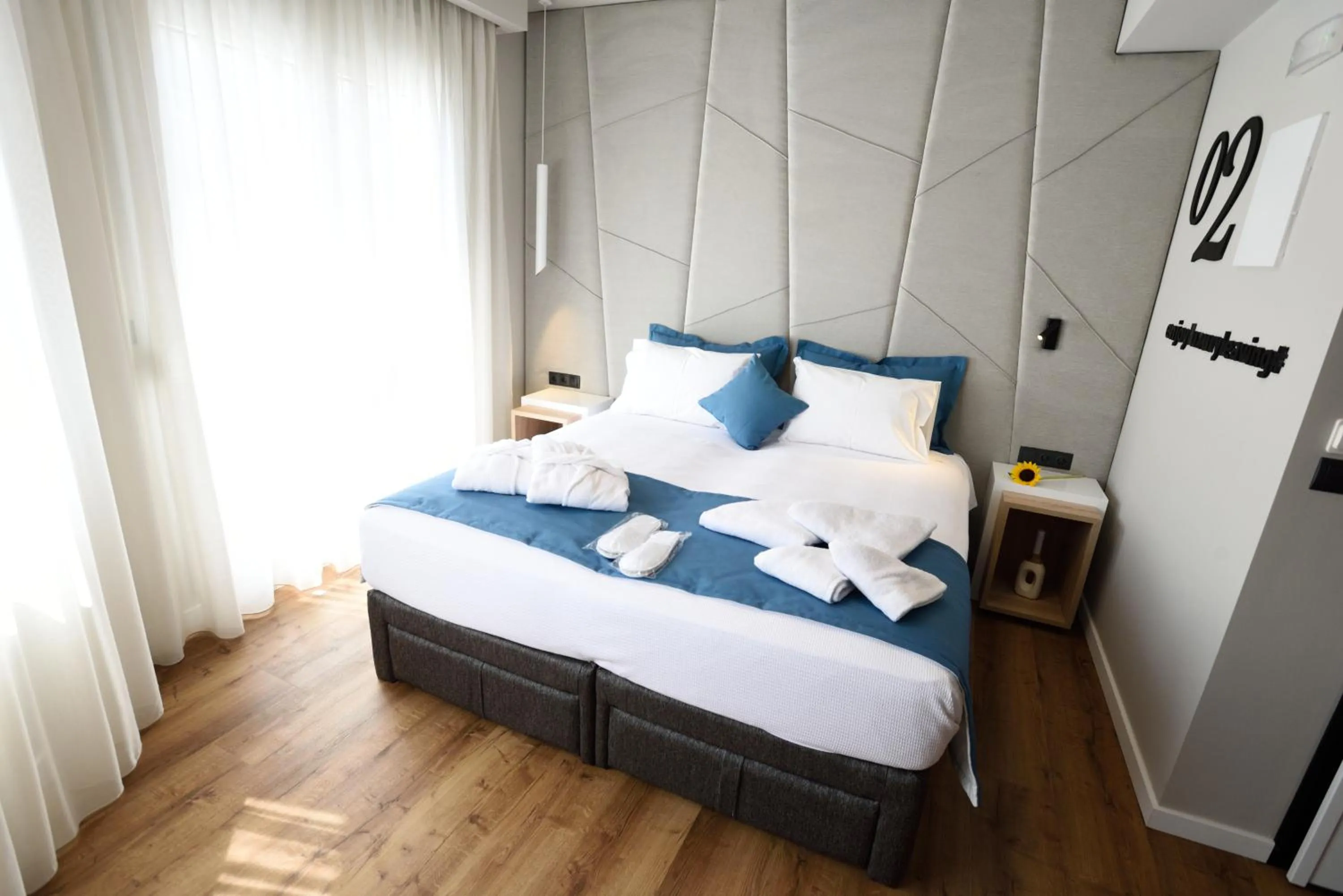 Bed in Magnifique Luxury Suites