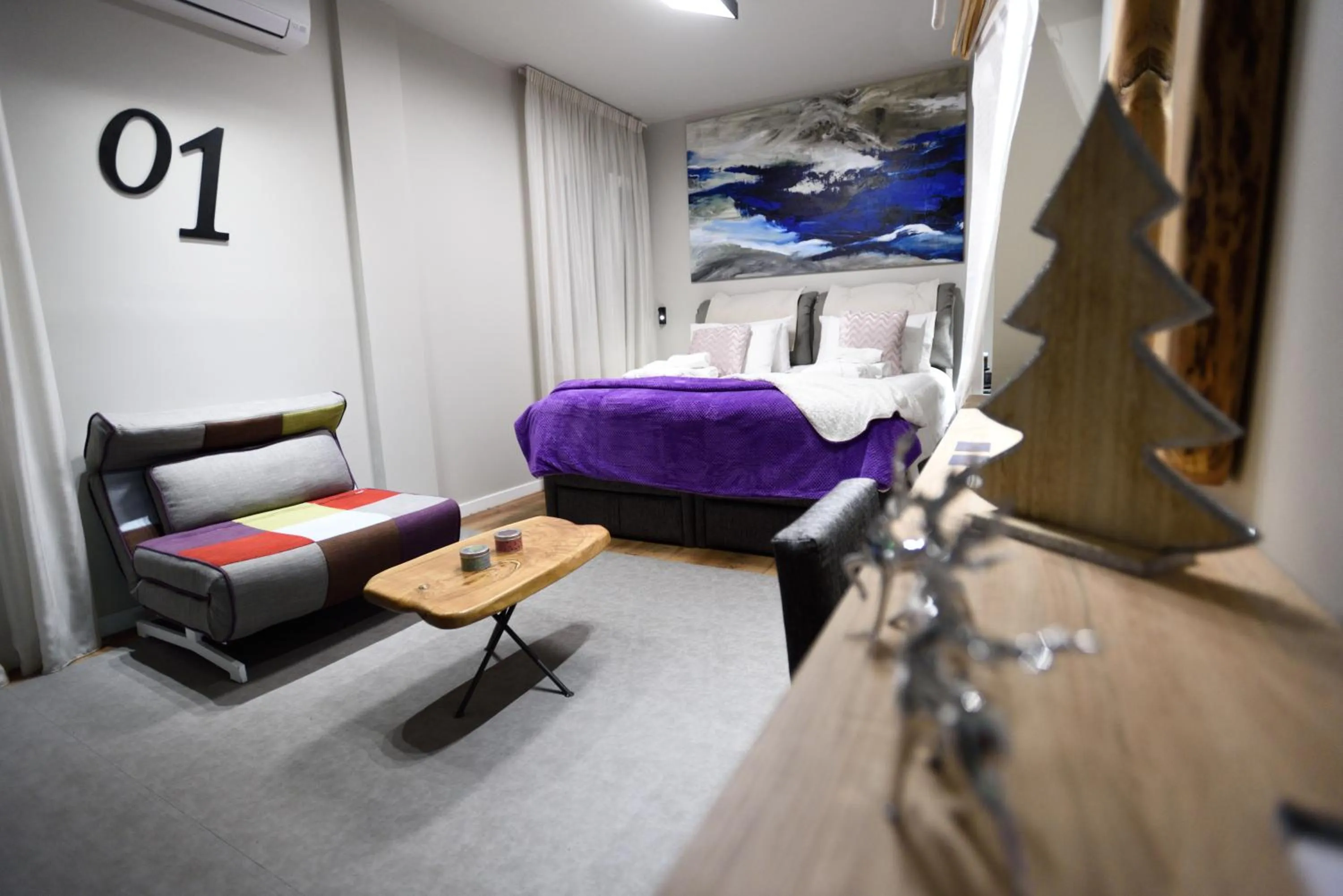 Bed in Magnifique Luxury Suites