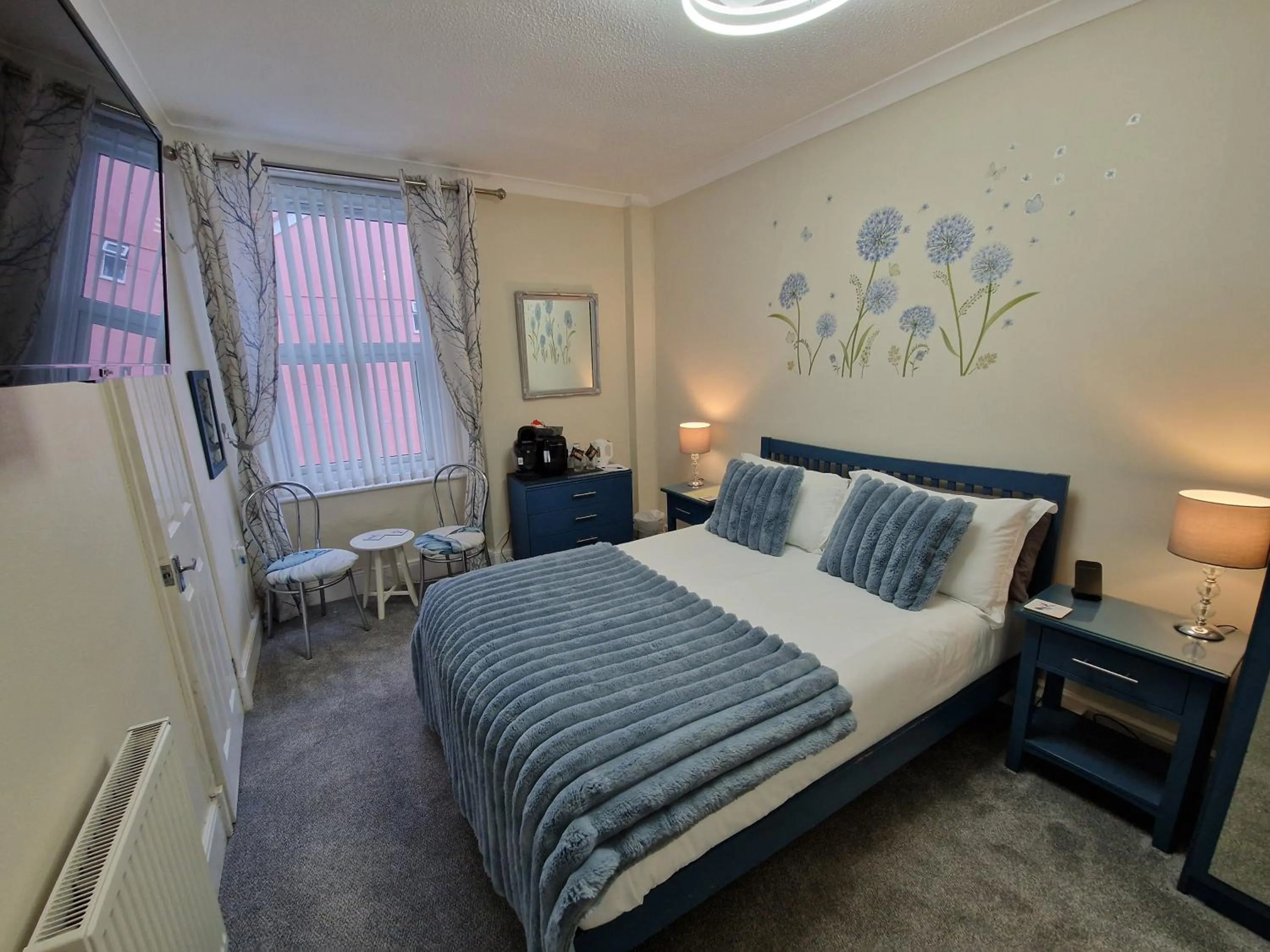 Bed in Ambassador Guest House