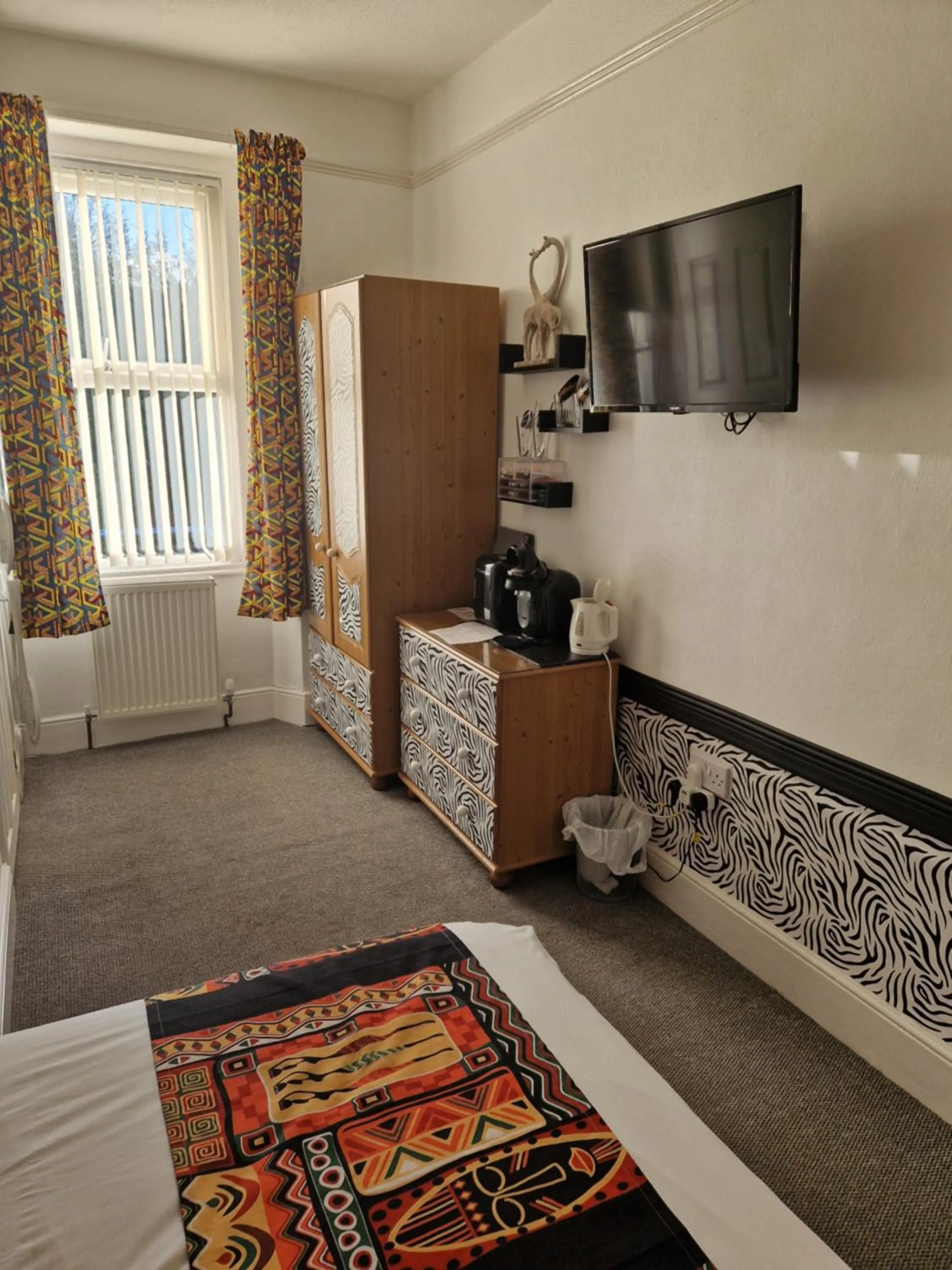 Coffee/tea facilities, Bed in Ambassador Guest House