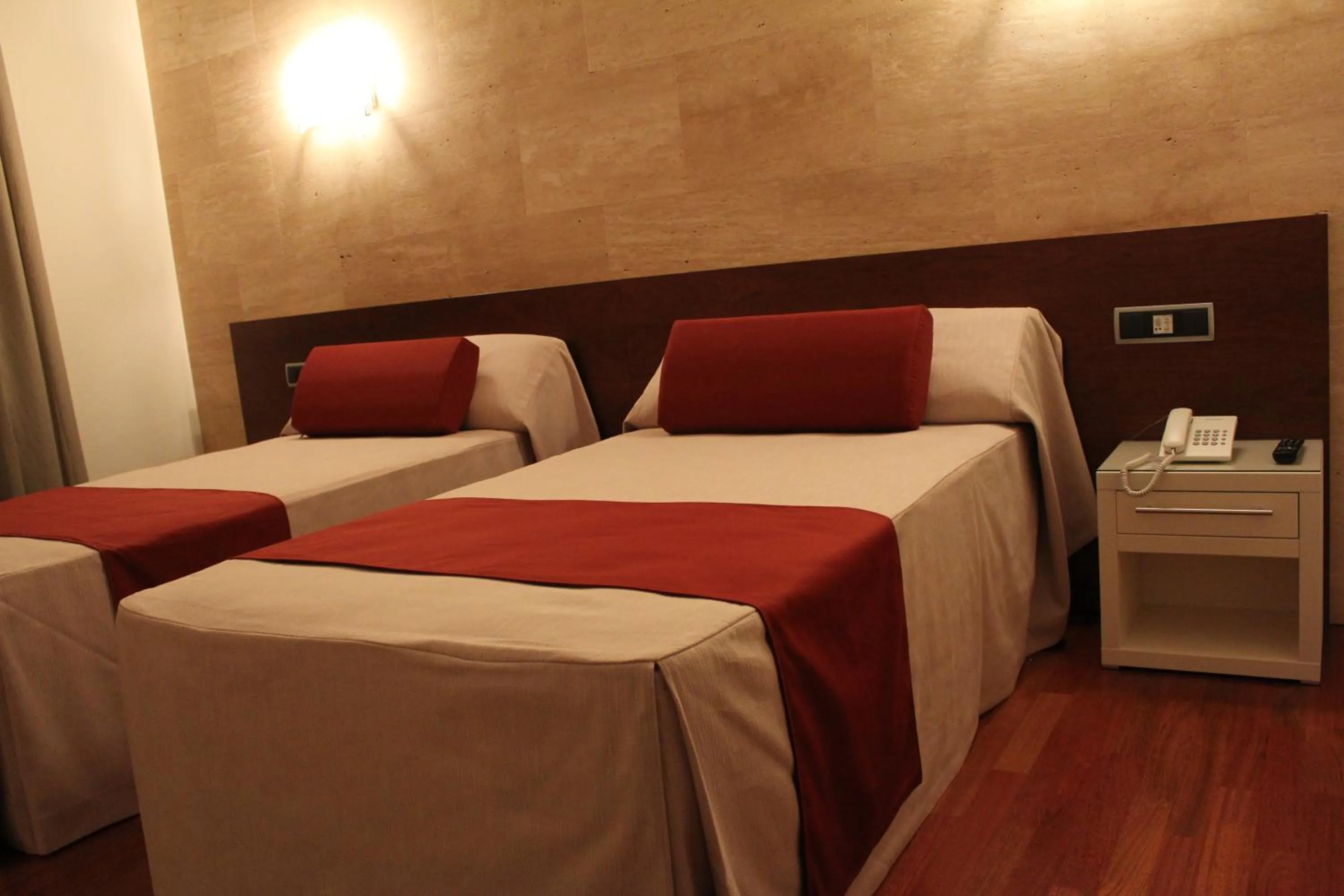 Bed in Escuderos Hotel Cruz