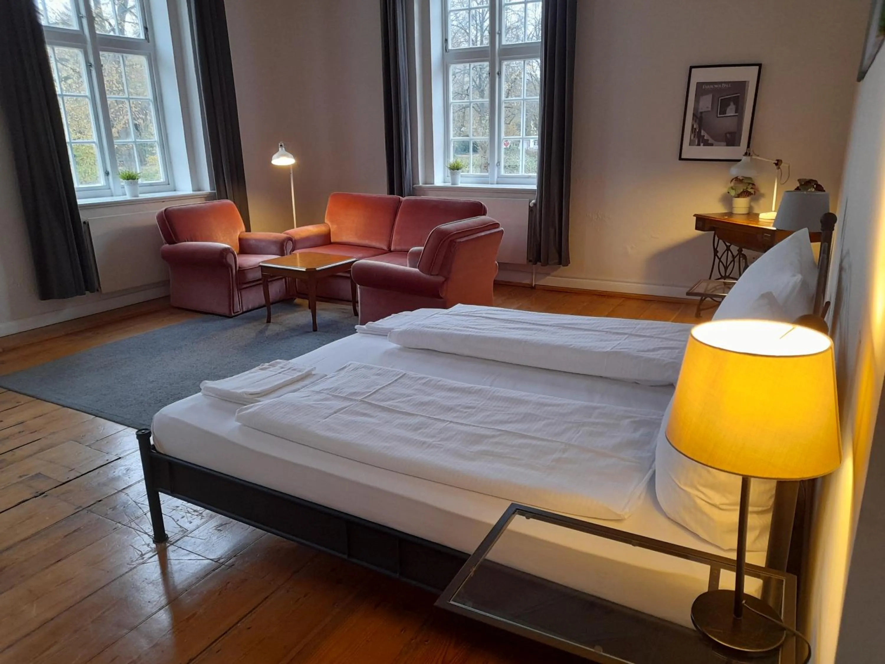 Seating area, Bed in Hotel Pelli Hof Rendsburg by Tulip Inn