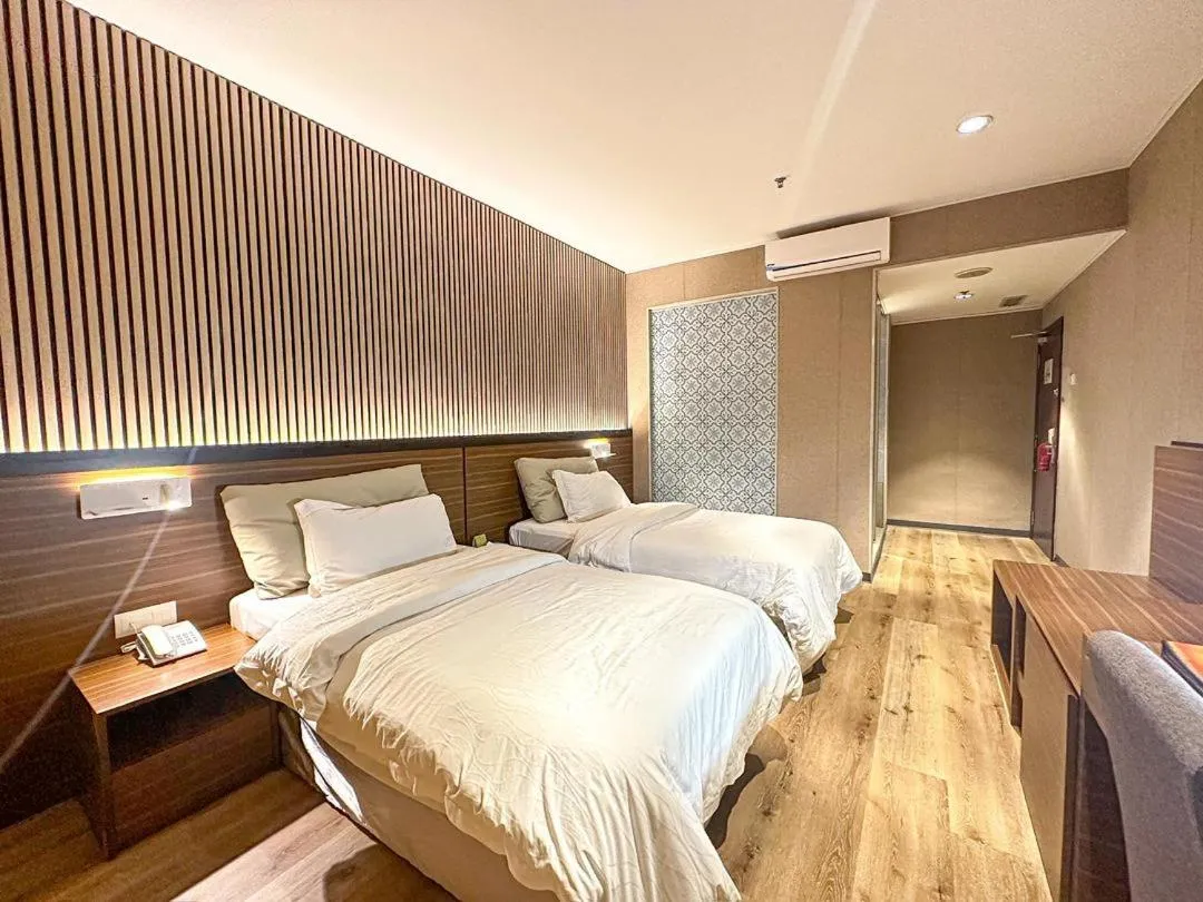 Bed in Pine Tree Hotel