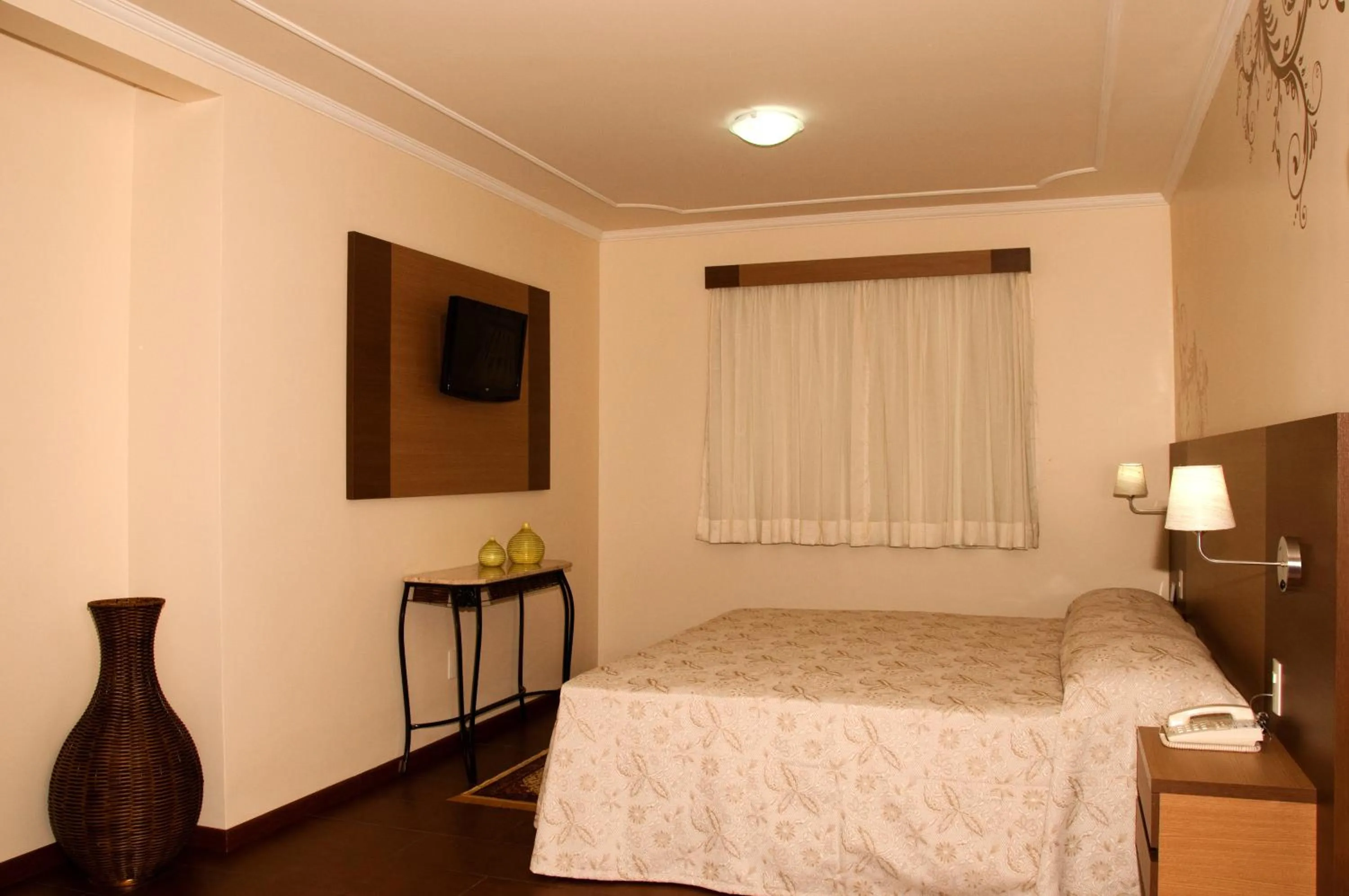 Decorative detail, Bed in Hotel Premium Pirassununga