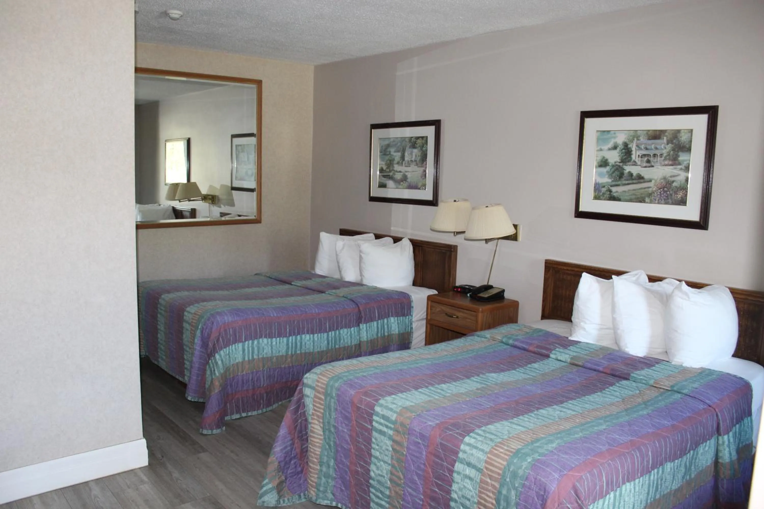 Bed in Bancroft Inn & Suites