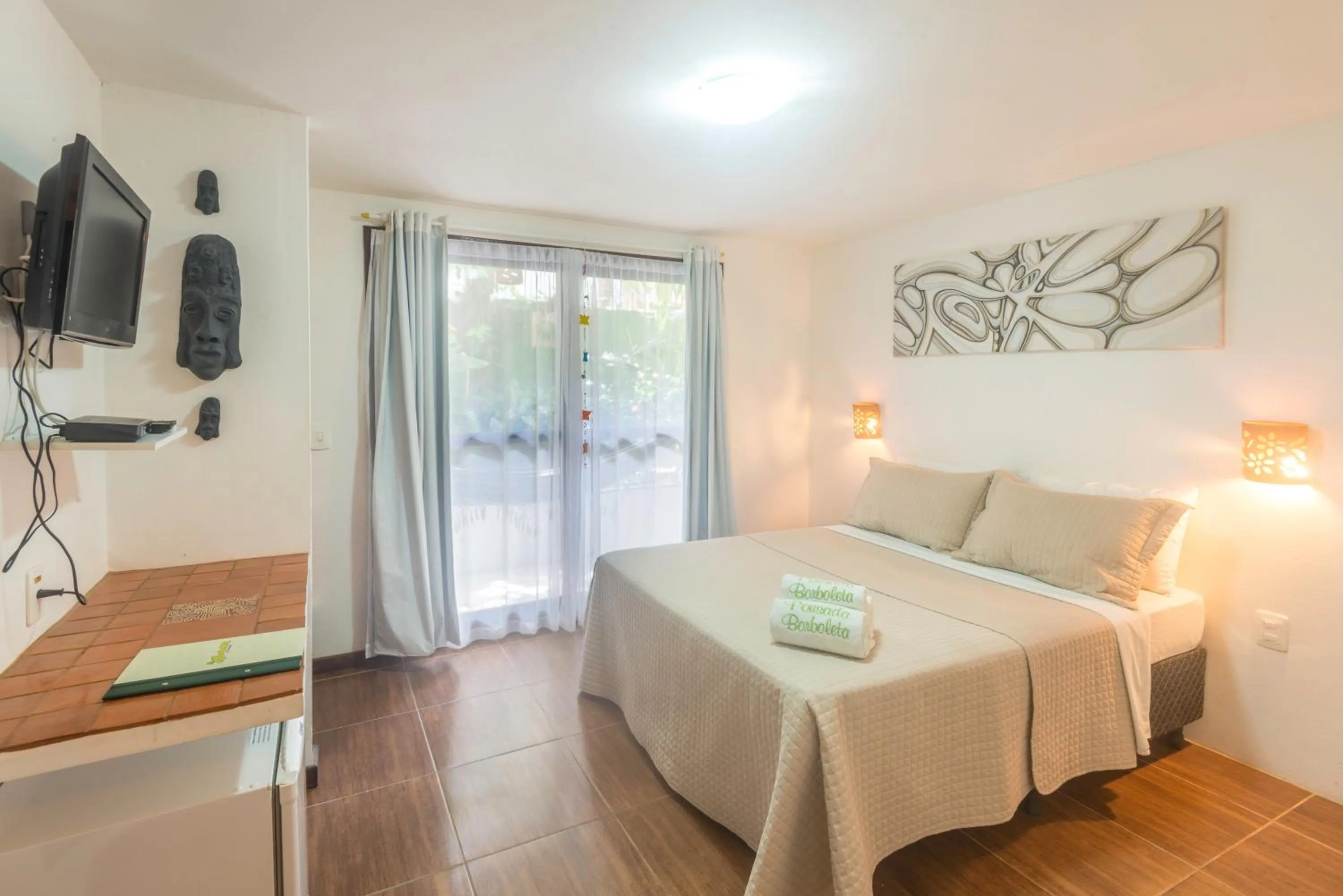 Photo of the whole room, Bed in Pousada Borboleta