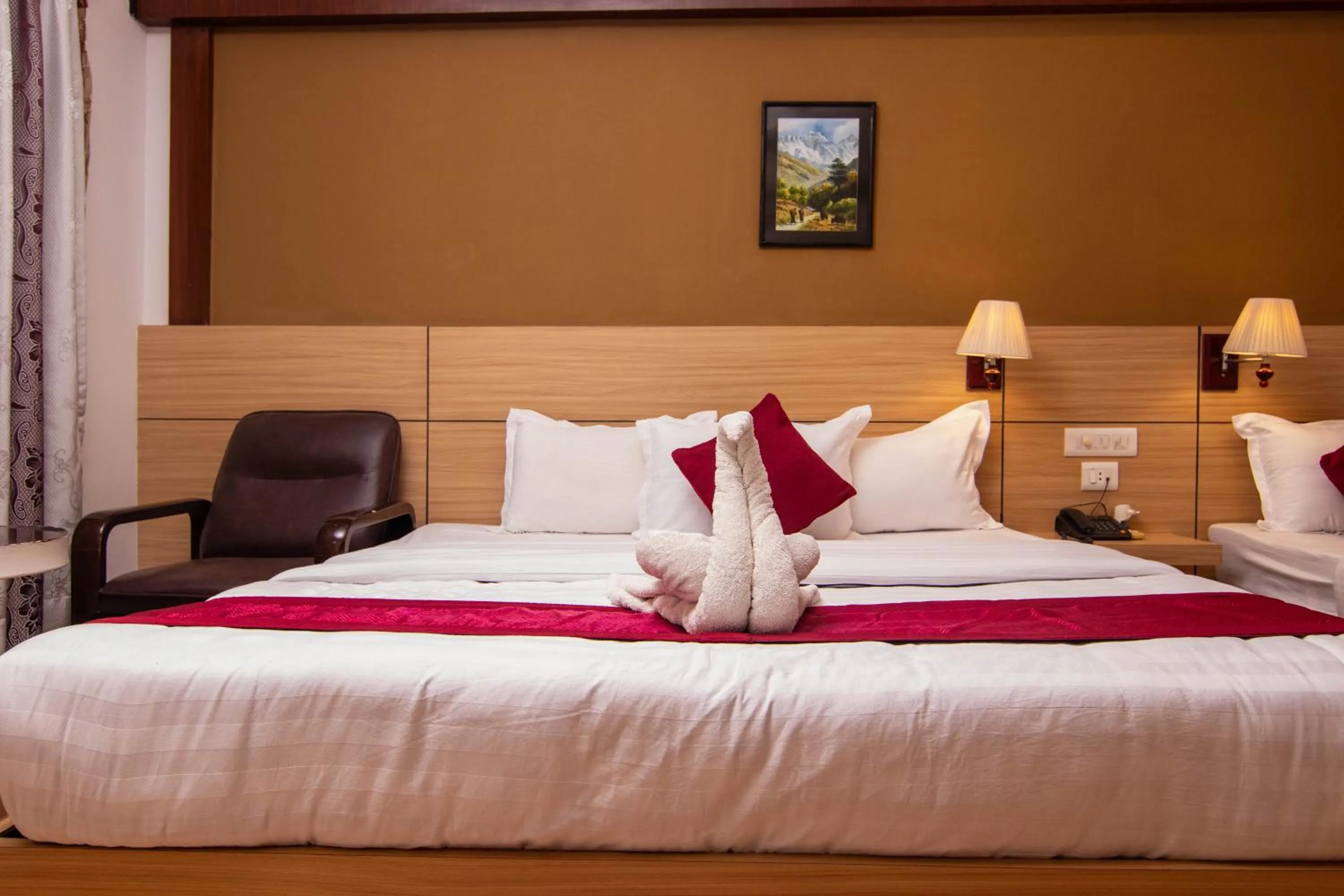 Bed in Hotel Ananda Inn