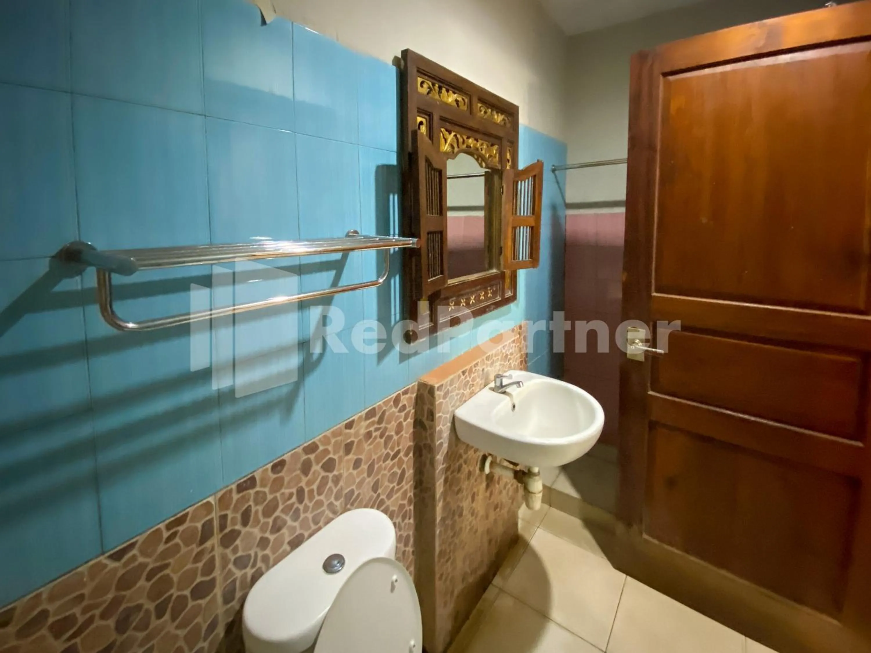 Bathroom in Istana Griya 2 Hotel Solo RedPartner