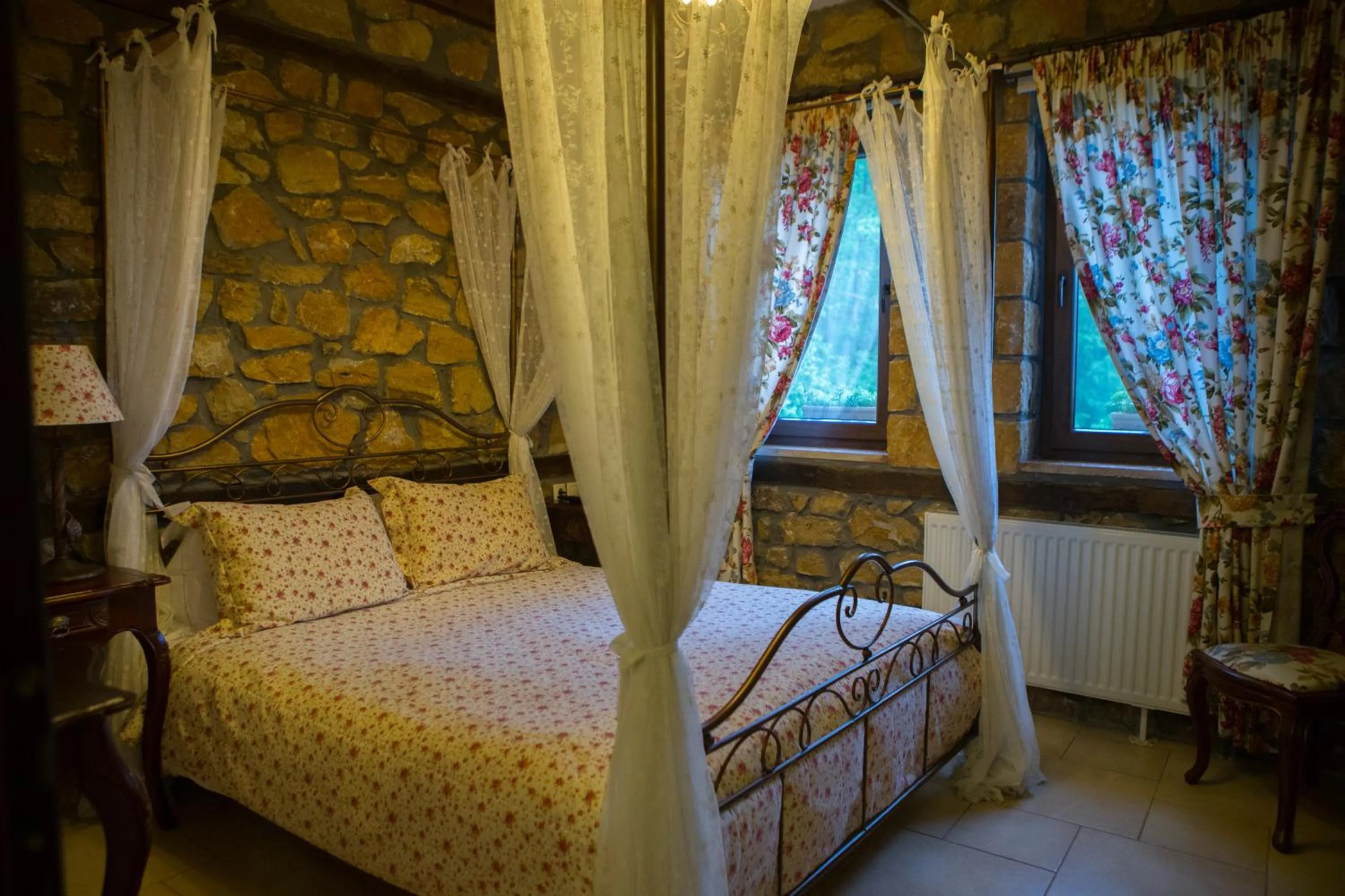 Photo of the whole room, Bed in Archontiko Emmanouilidi Suites
