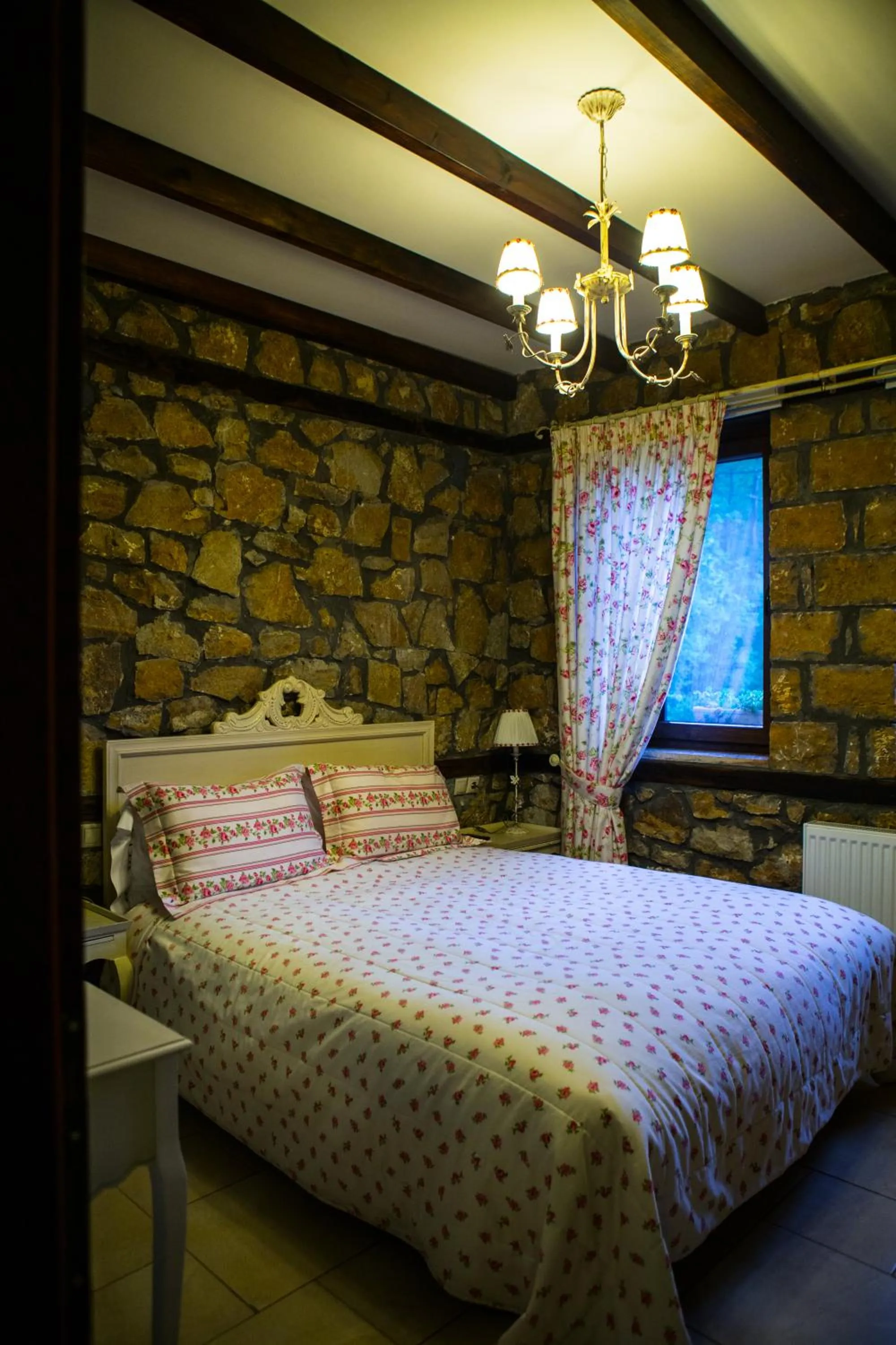 Decorative detail, Bed in Archontiko Emmanouilidi Suites