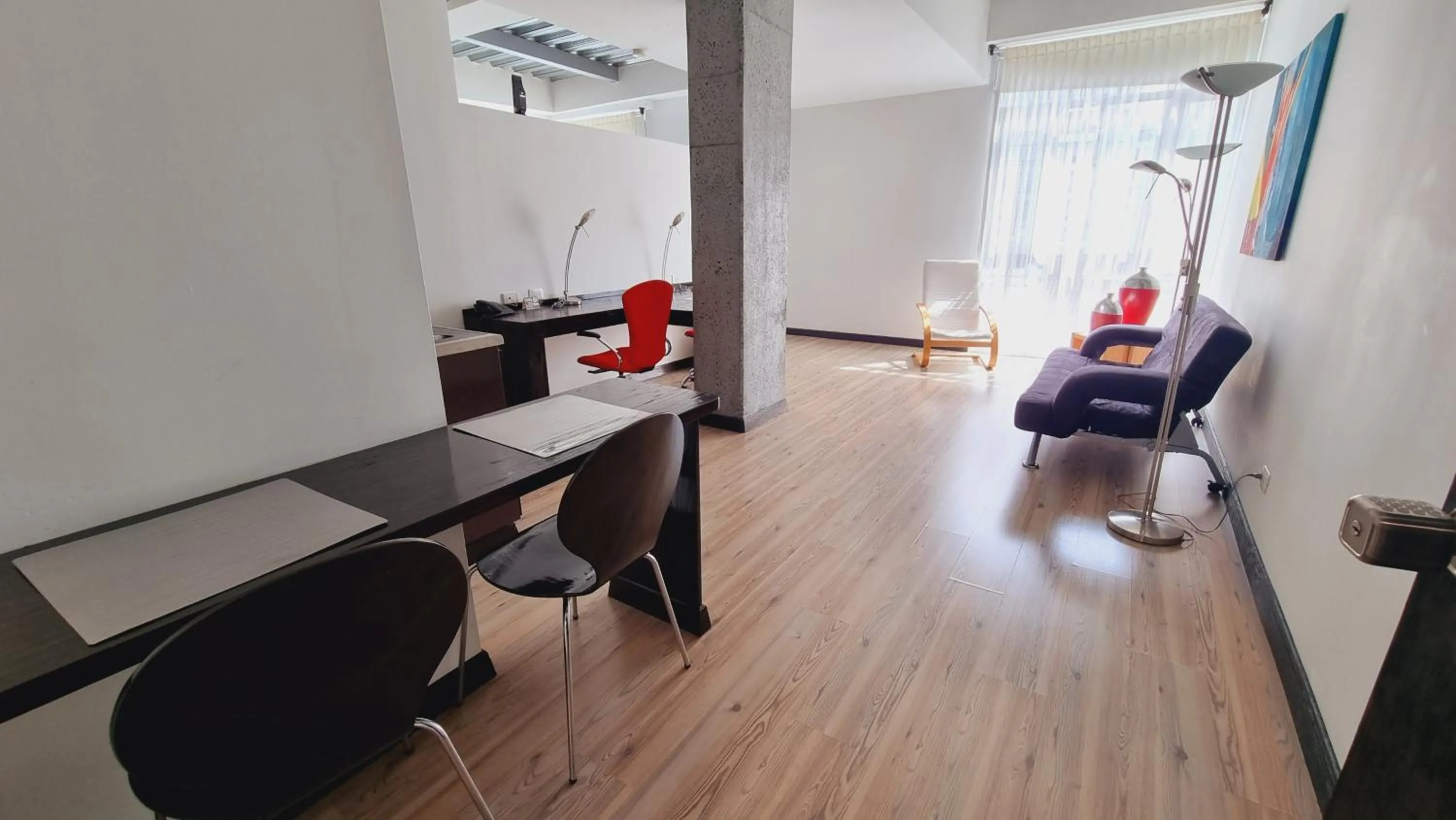 Living room in Habitat Suites Hotel By GHO Hoteles