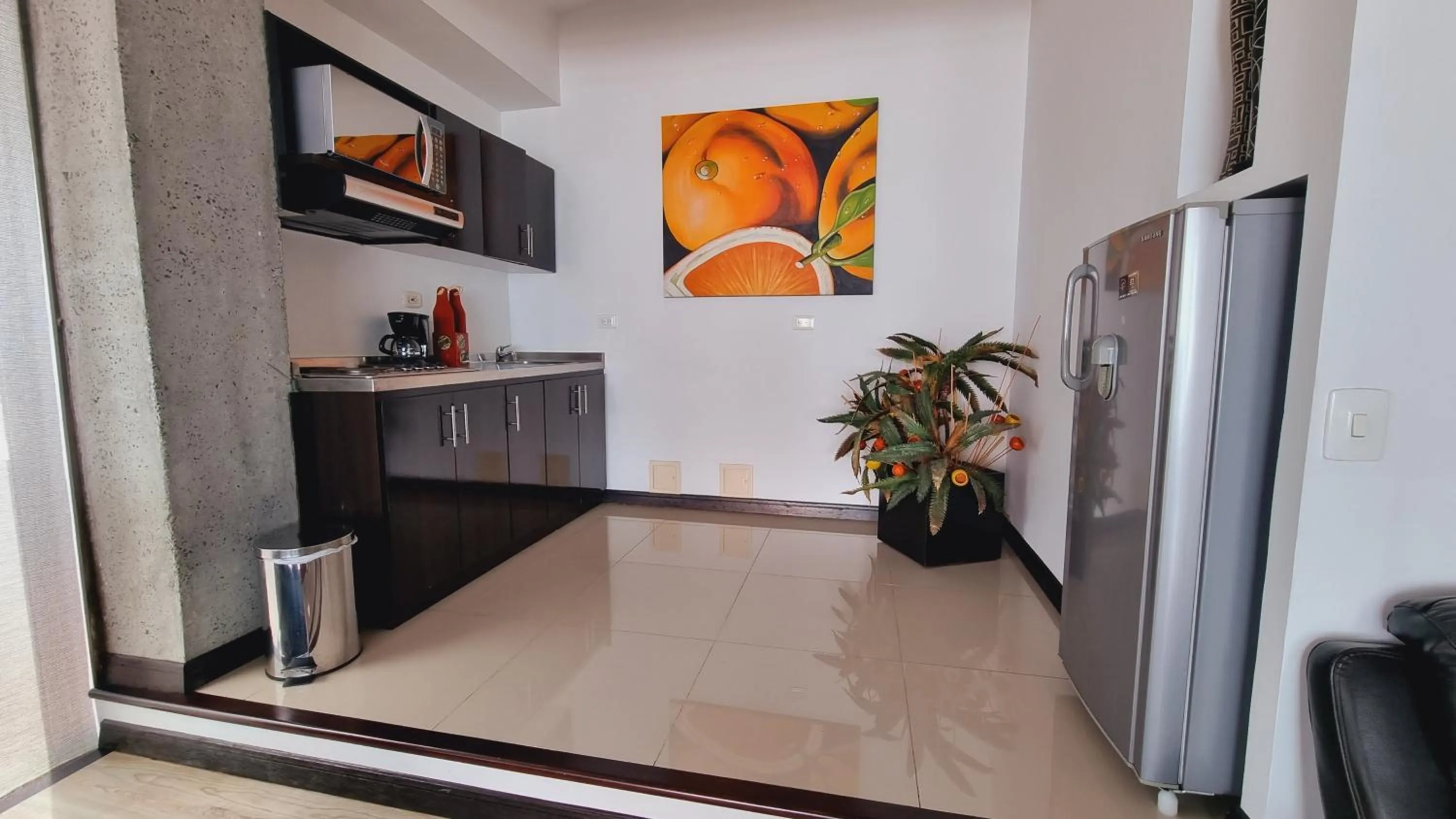 Kitchen or kitchenette in Habitat Suites Hotel By GHO Hoteles
