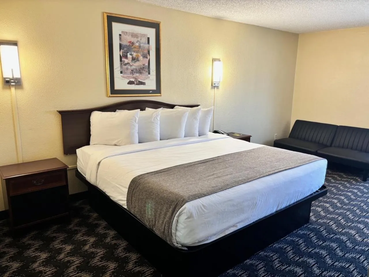 Bed in The Inn and Suites at 34 Fifty