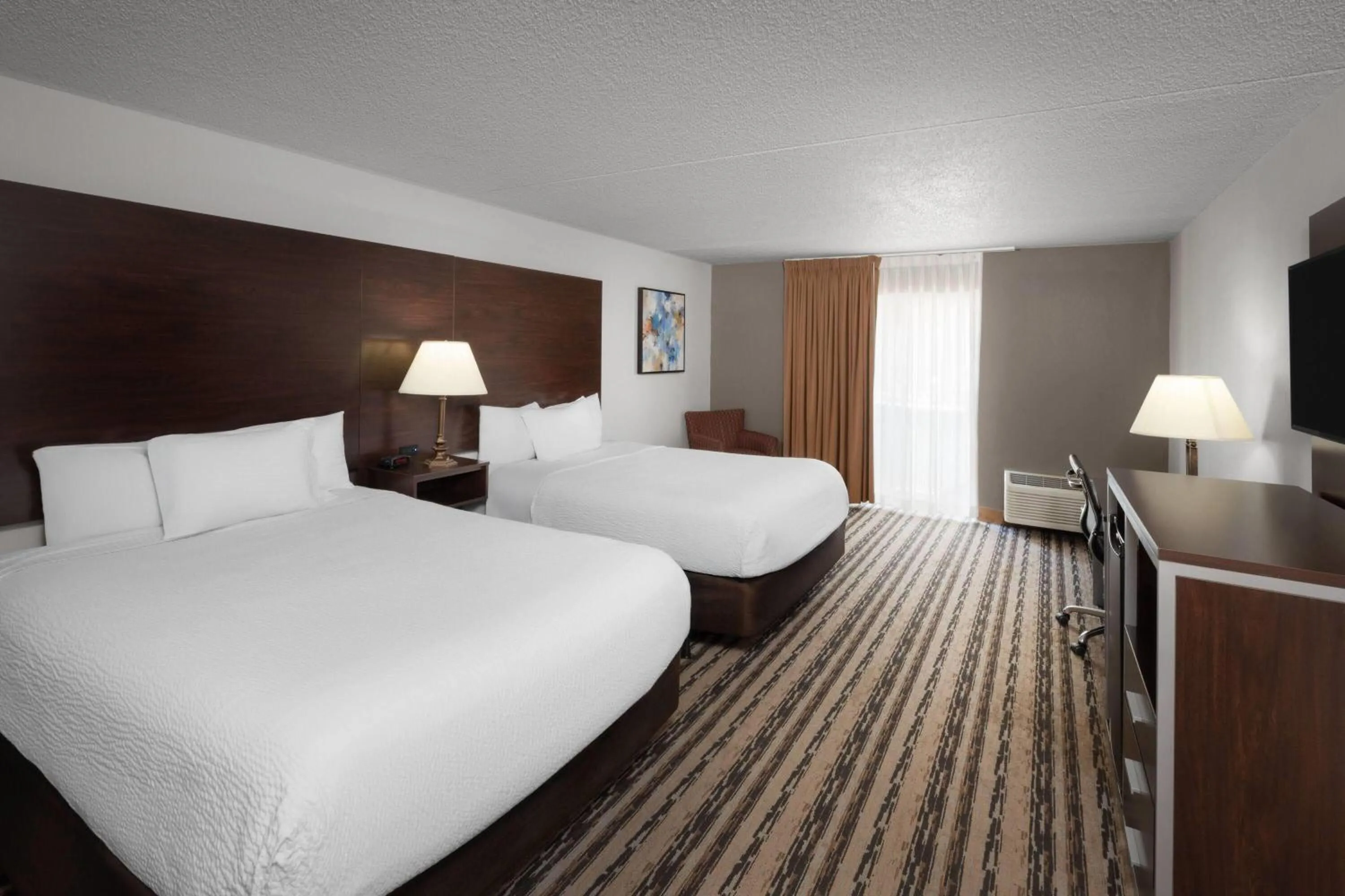 Photo of the whole room, Bed in Endeavor Inn & Suites, Trademark Collection by Wyndham