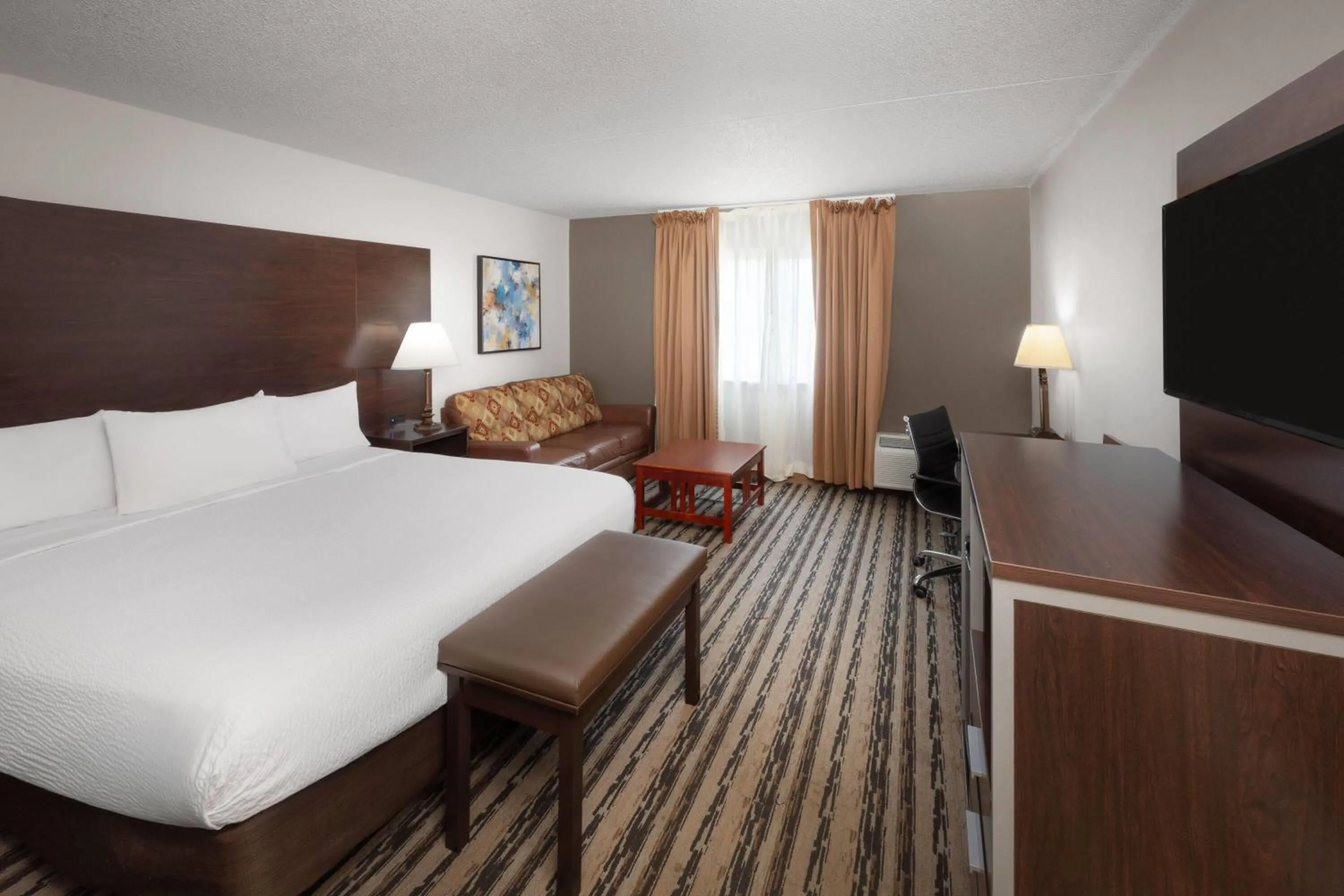 Photo of the whole room, Bed in Endeavor Inn & Suites, Trademark Collection by Wyndham
