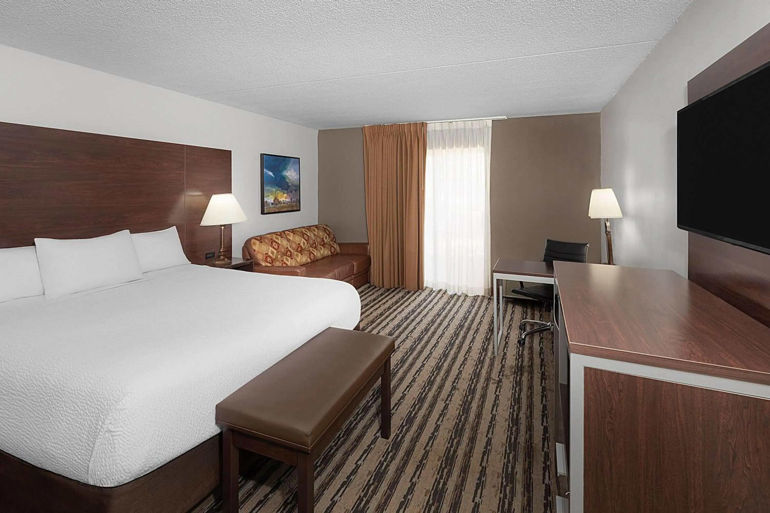 Photo of the whole room, Bed in Endeavor Inn & Suites, Trademark Collection by Wyndham