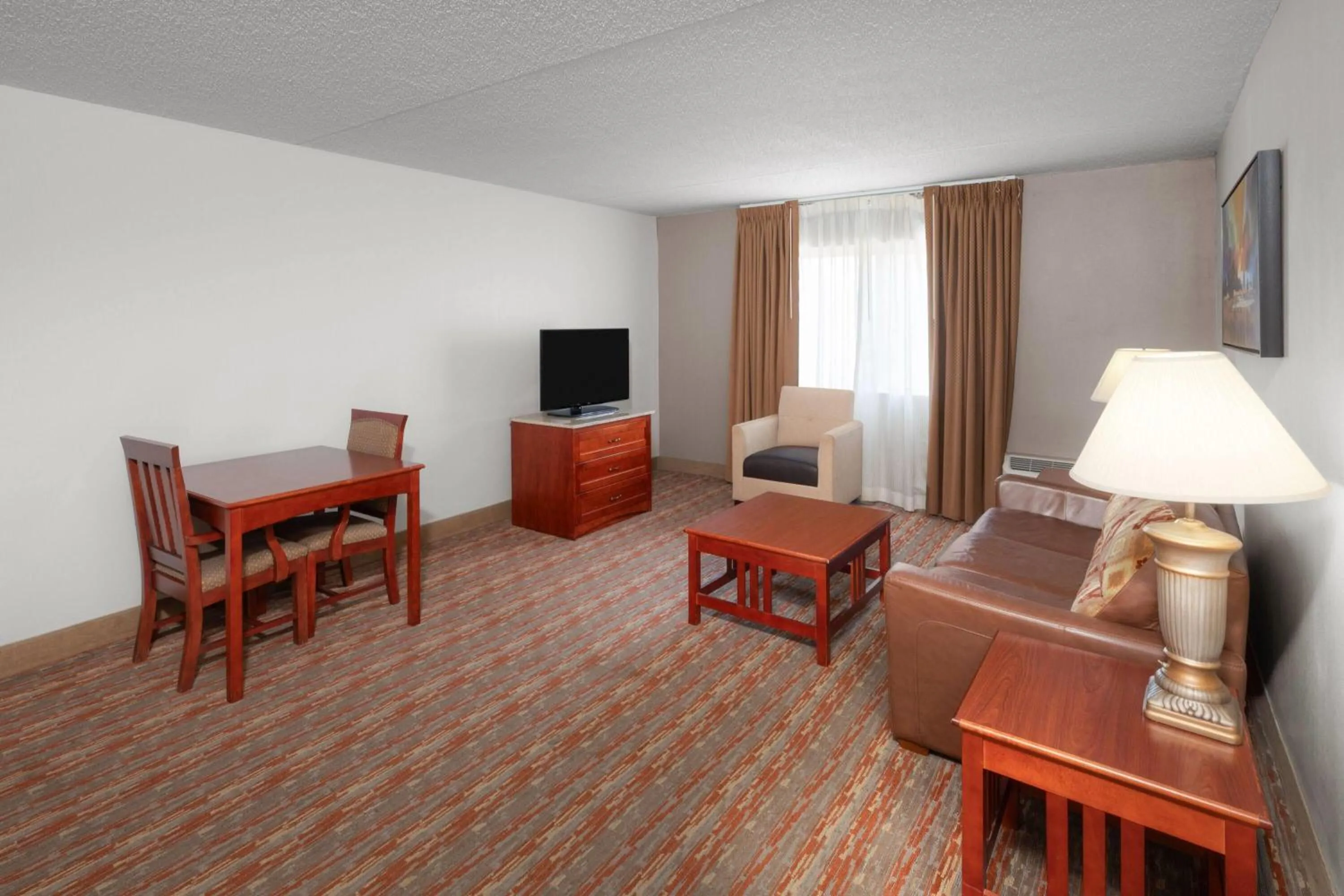 Photo of the whole room in Endeavor Inn & Suites, Trademark Collection by Wyndham