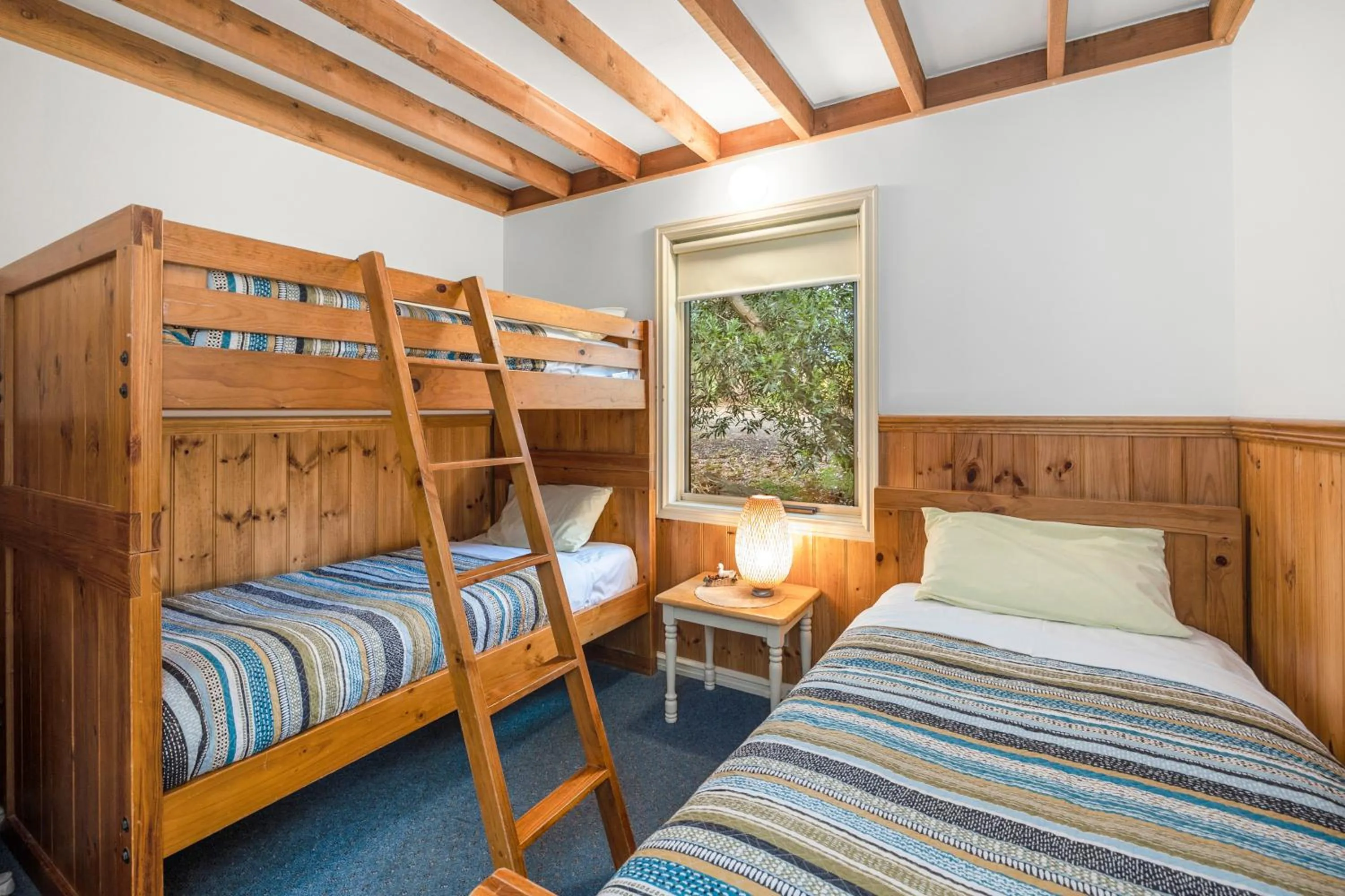 Bed in Lorne Bush House Cottages & Eco Retreats