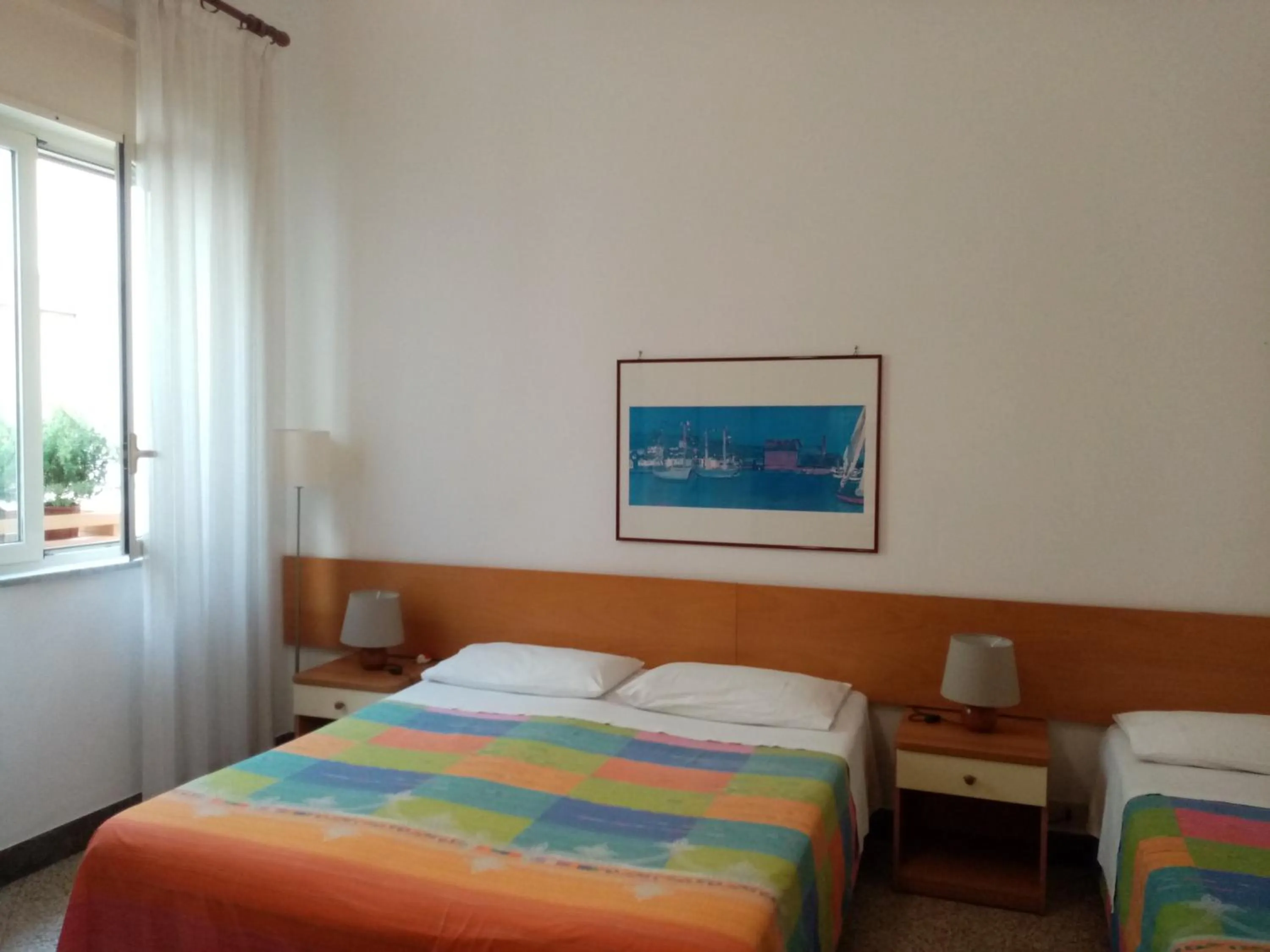 Bed in Ariston Petit Hotel