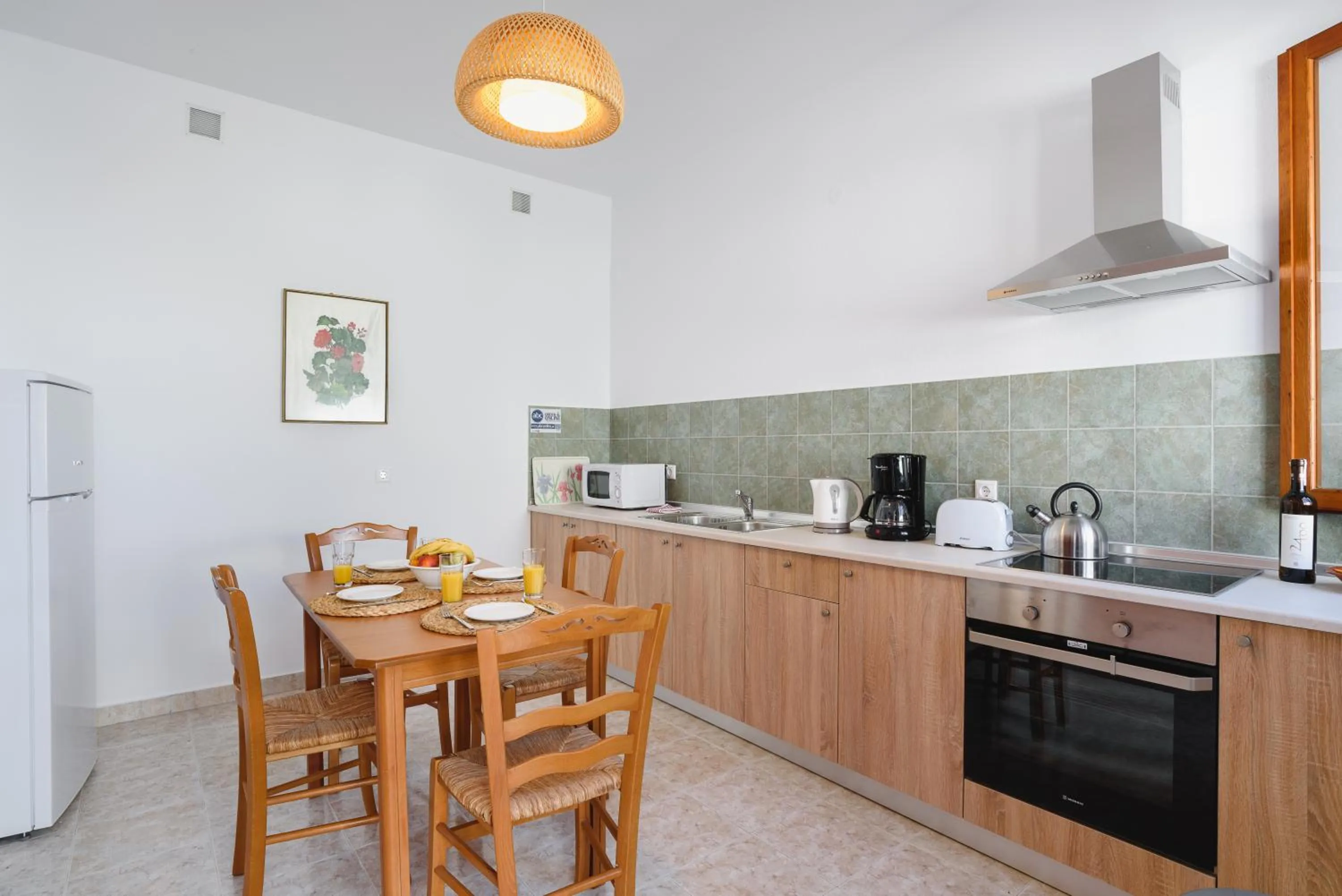 Kitchen or kitchenette in Thea Villas and Suite