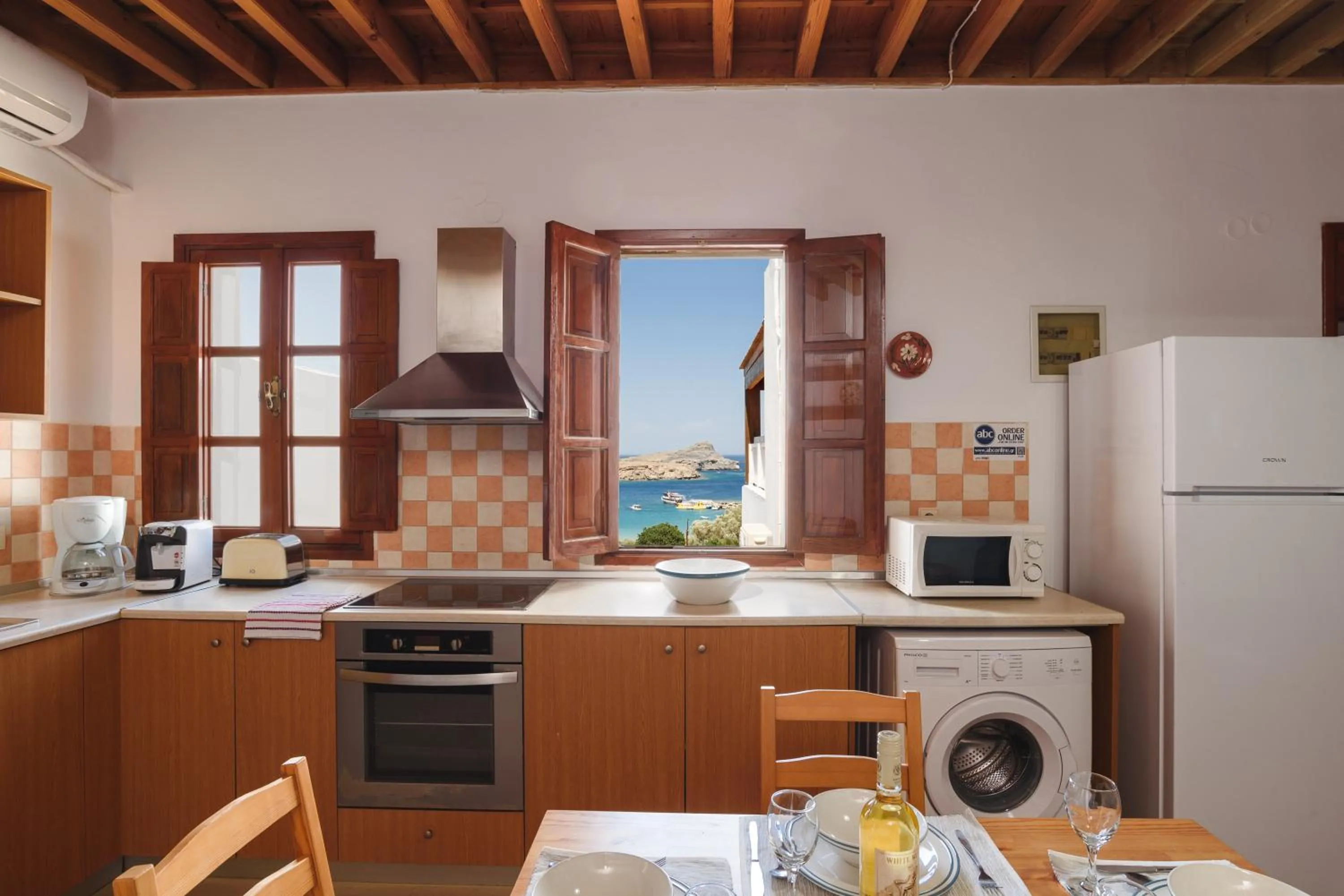 Kitchen or kitchenette in Thea Villas and Suite