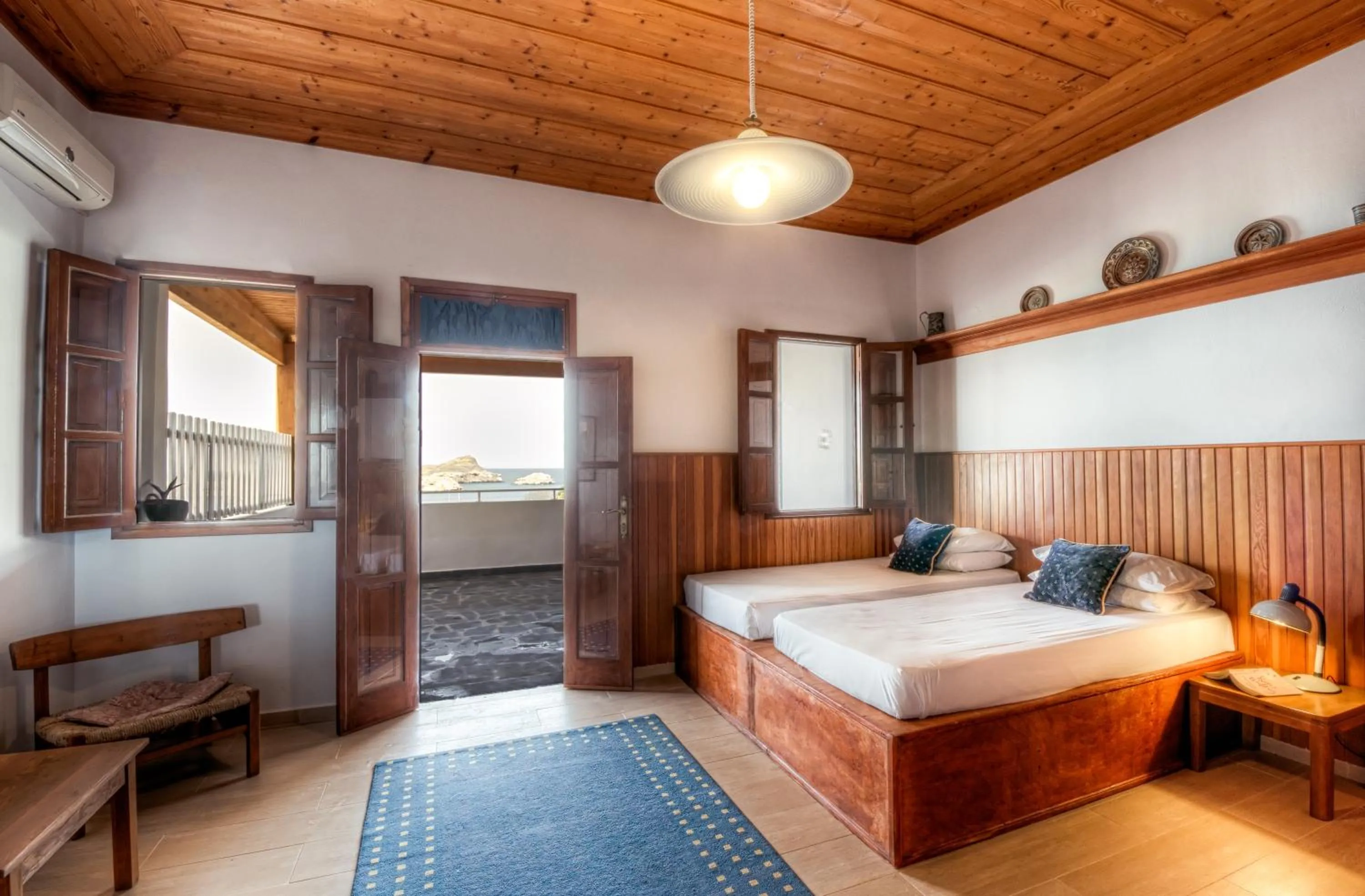 Bed in Thea Villas and Suite