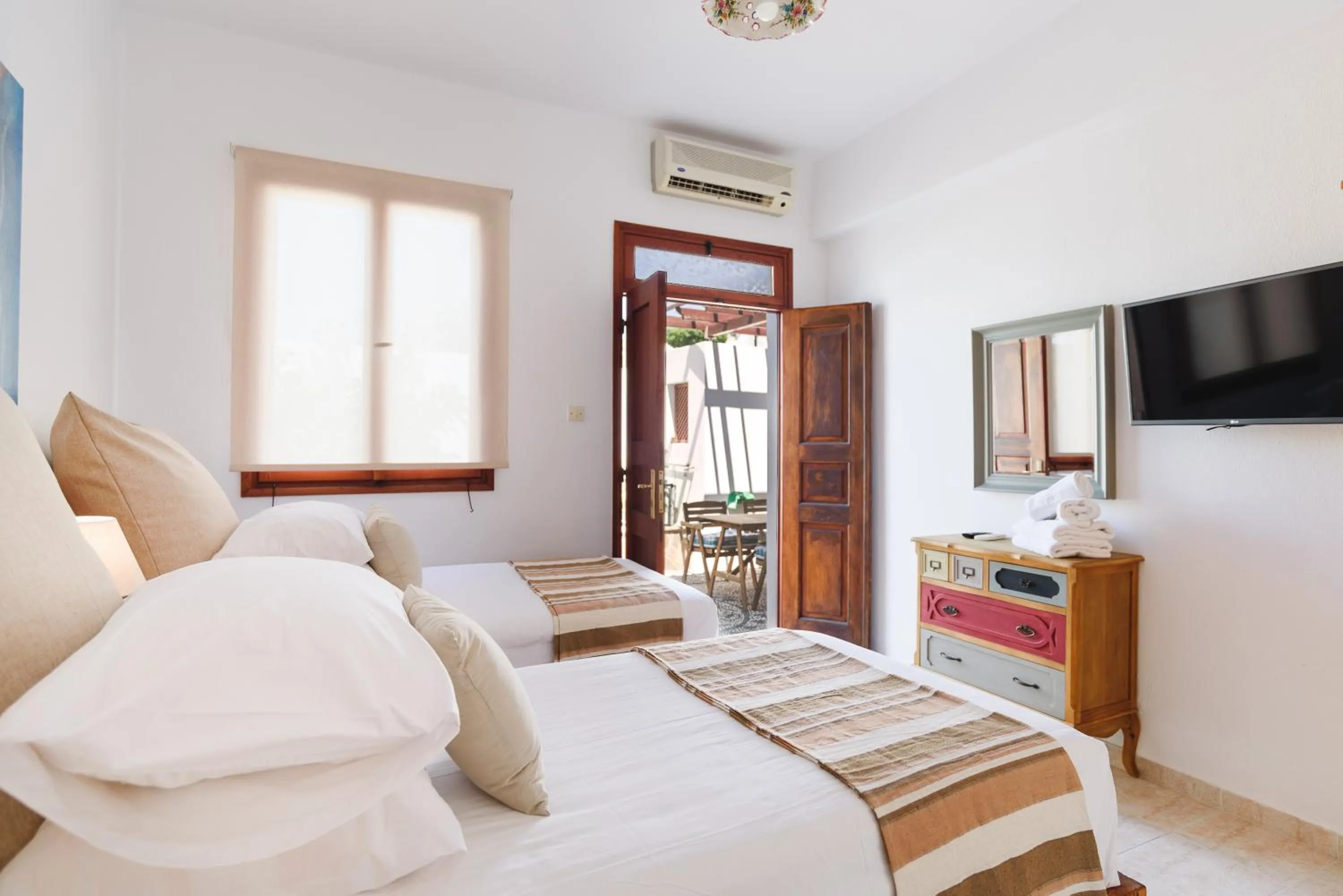 Bed in Thea Villas and Suite