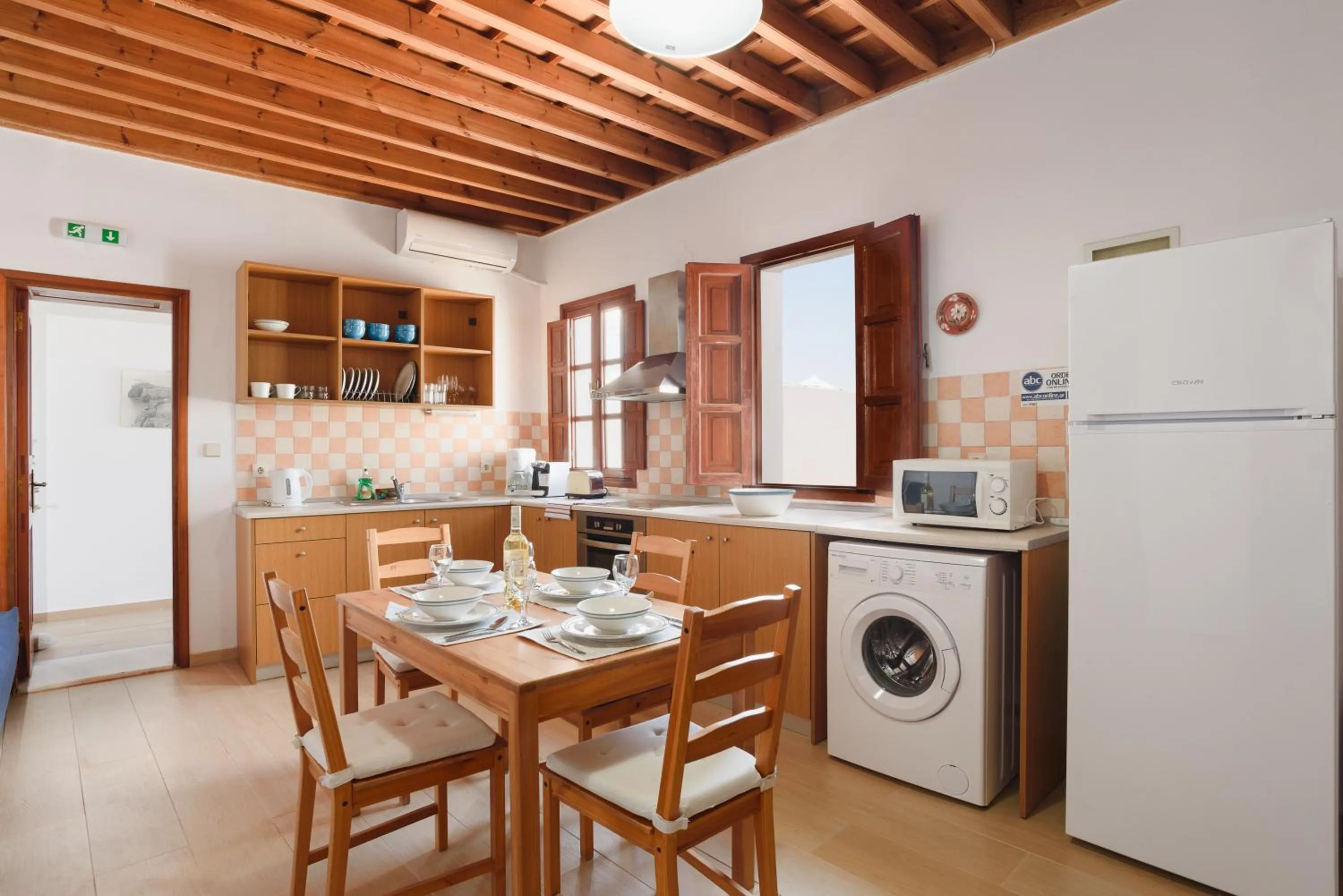 Kitchen or kitchenette in Thea Villas and Suite