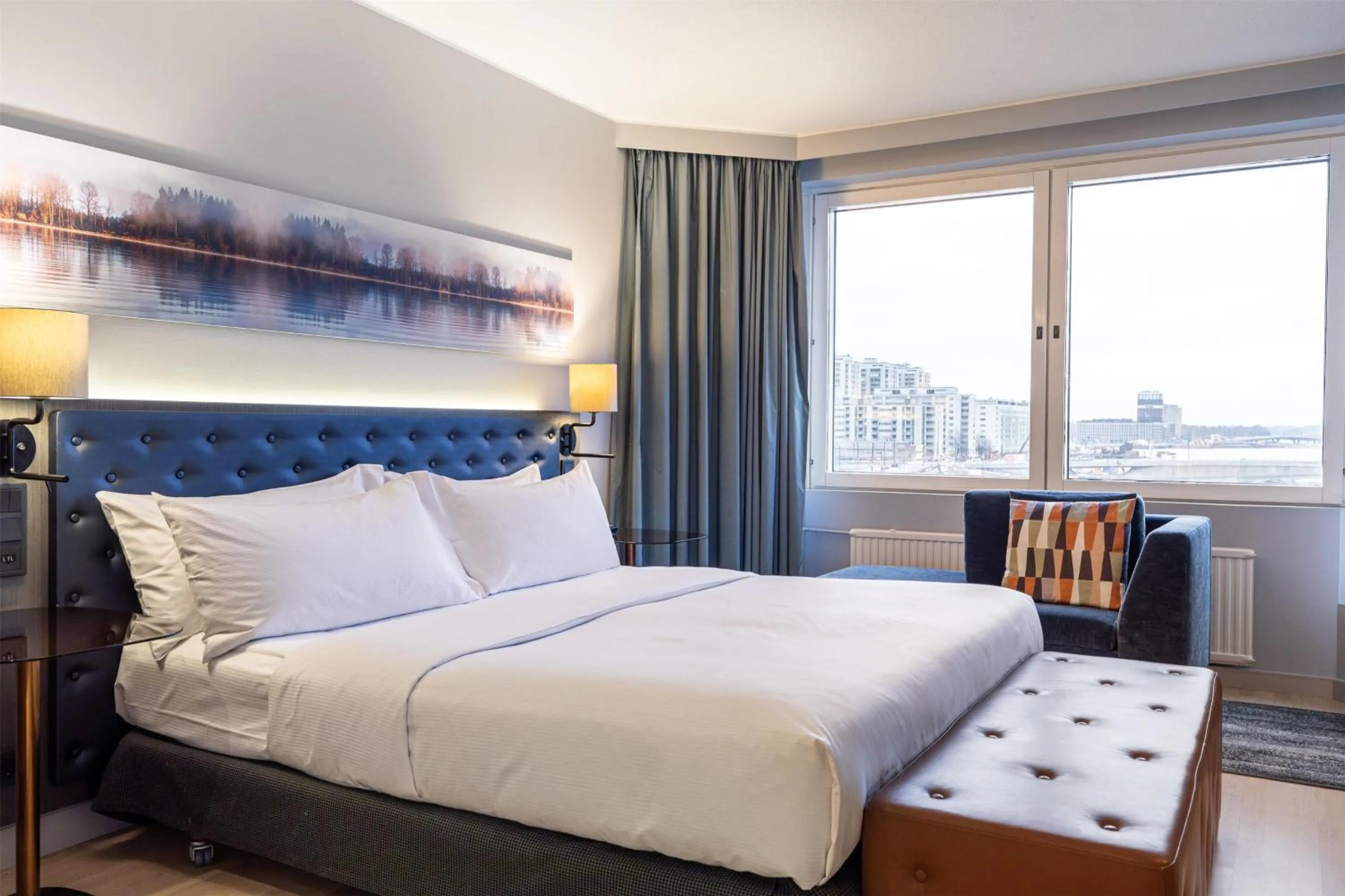 Living room, Bed in Hilton Helsinki Strand