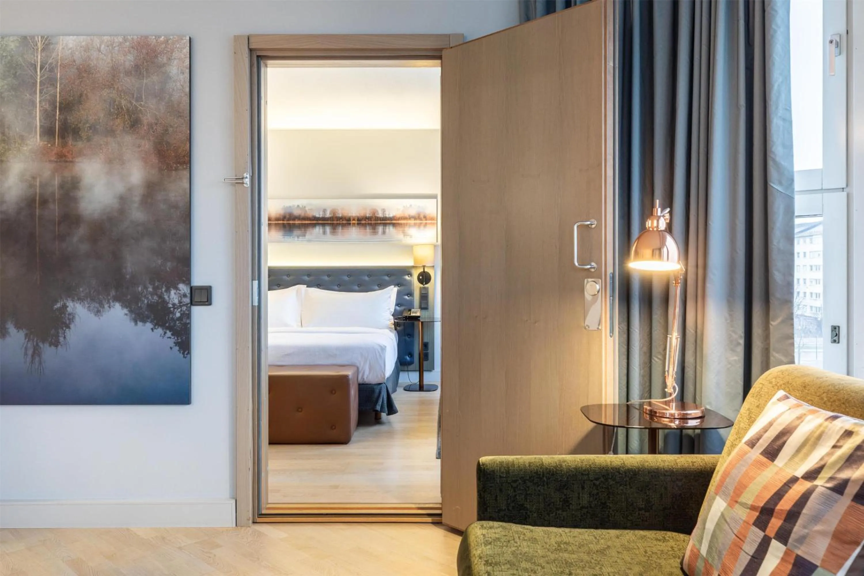 Living room, Bed in Hilton Helsinki Strand