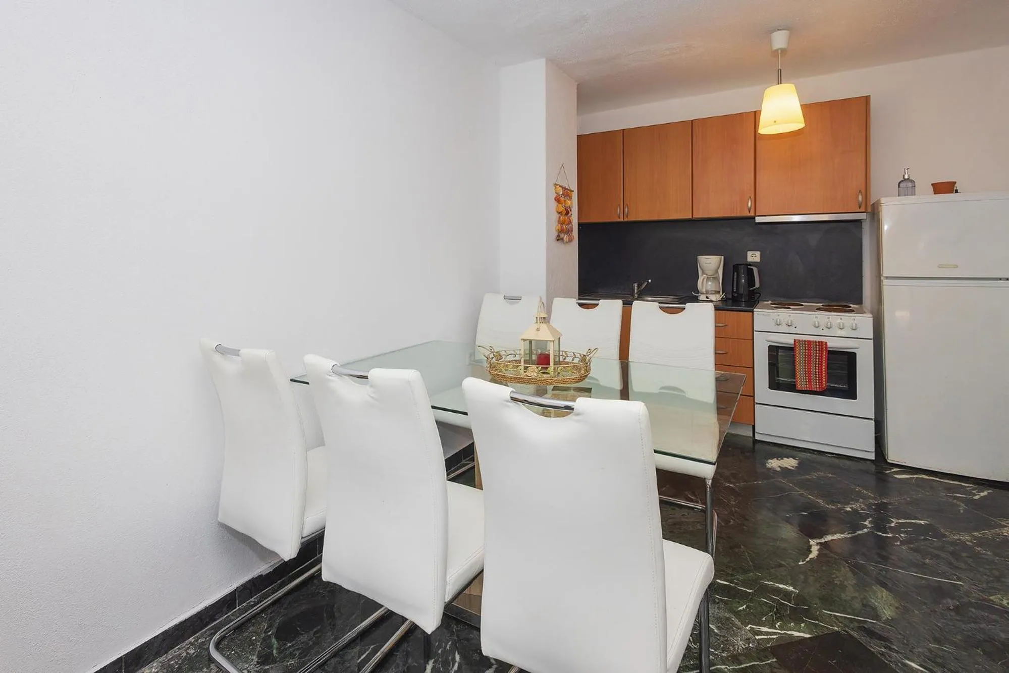 Kitchen or kitchenette in Salonikiou Beach Apartments & Villas