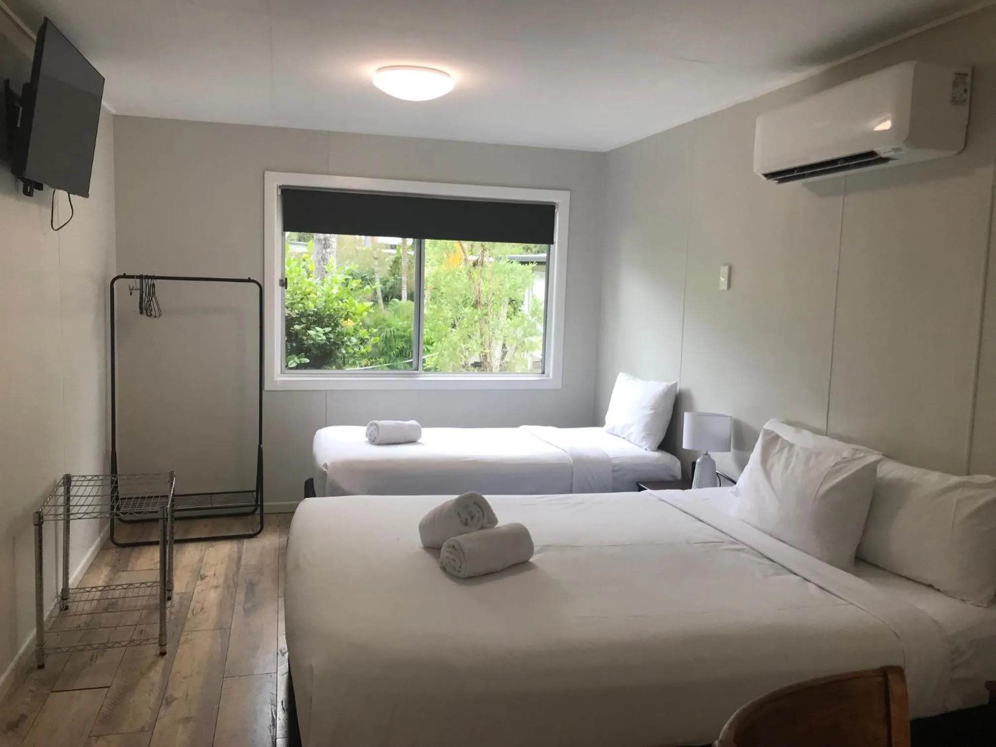 Bed in Bush Village Holiday Cabins