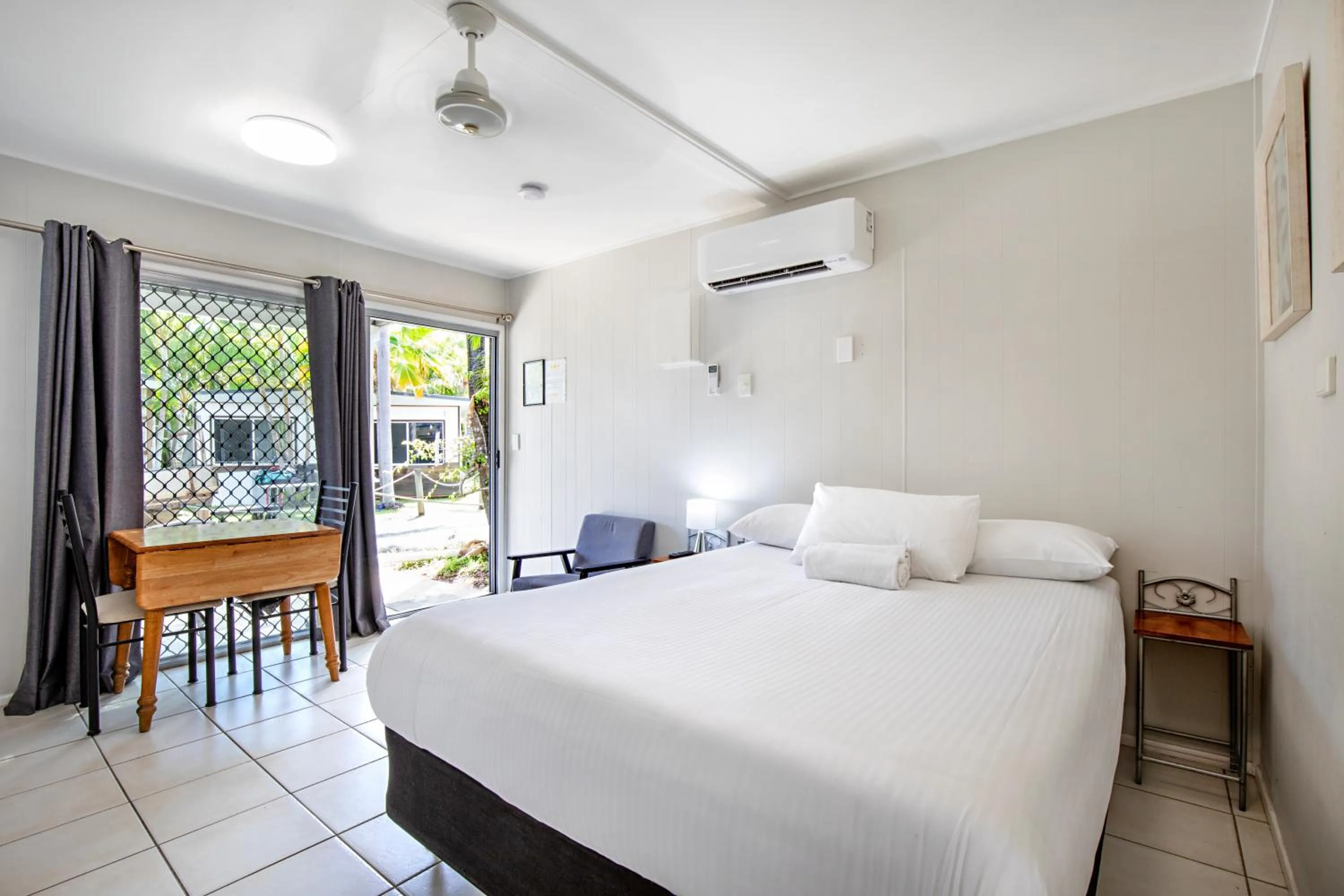 Bed in Bush Village Holiday Cabins