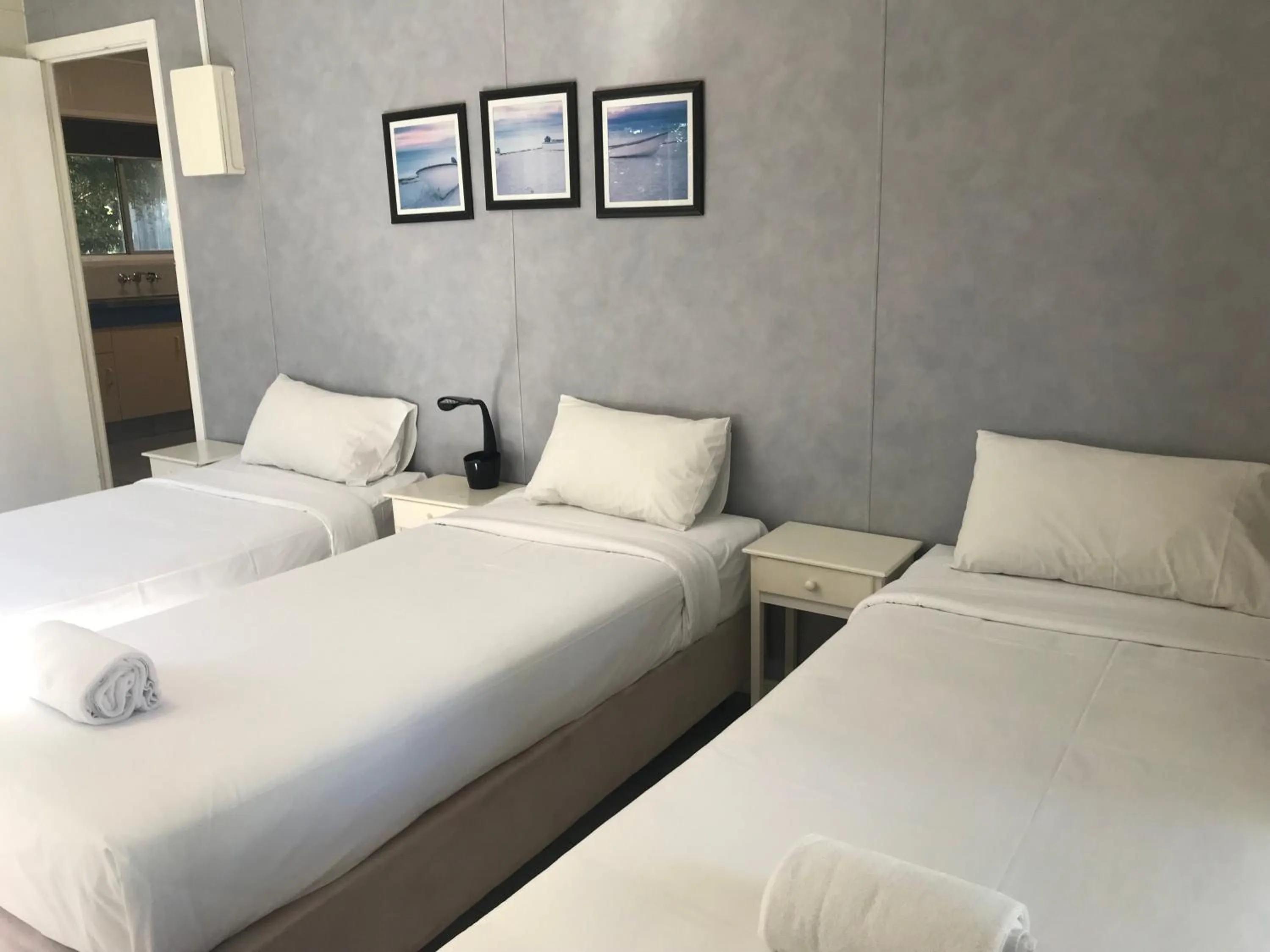 Bed in Bush Village Holiday Cabins