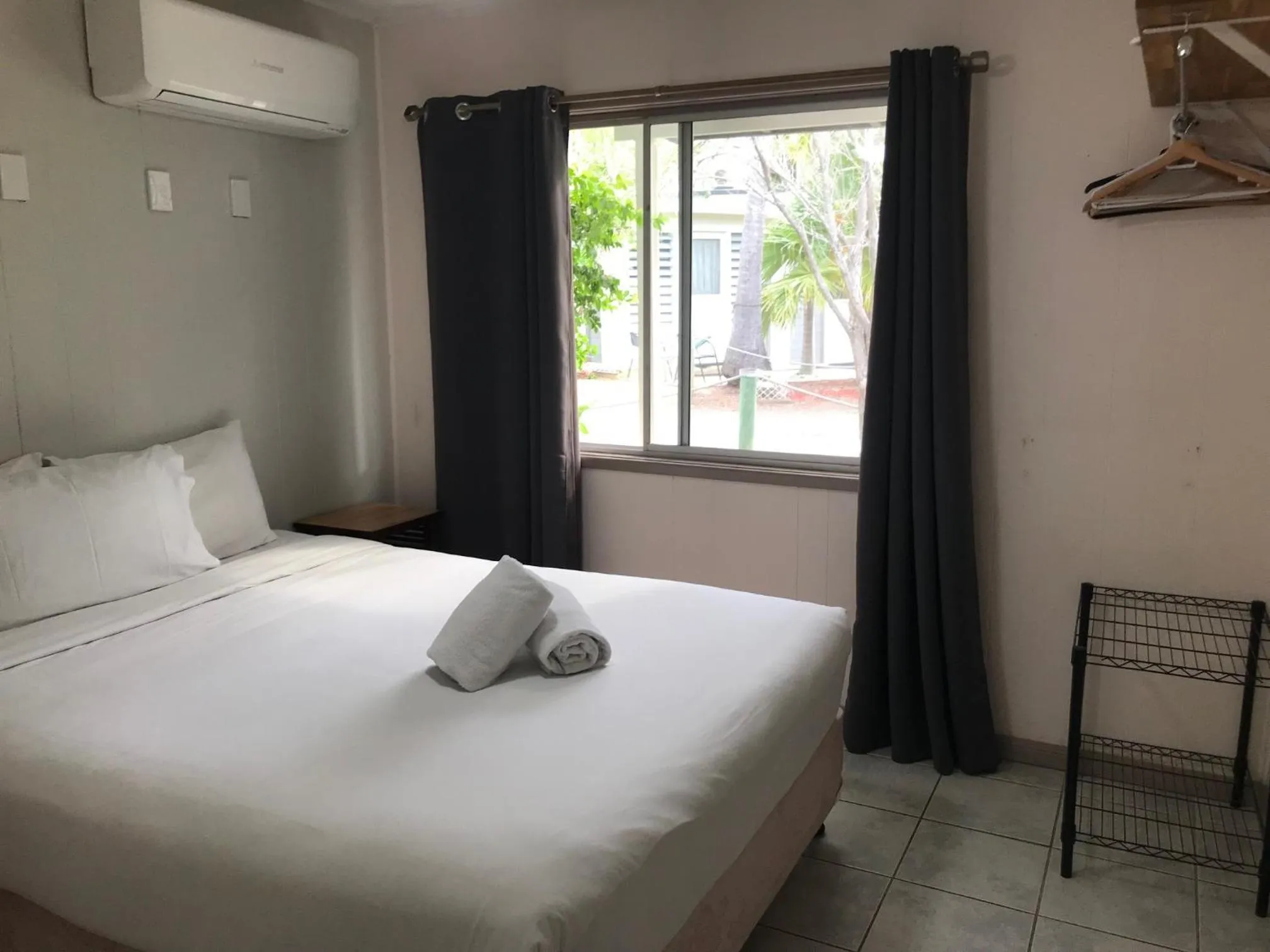 Bed in Bush Village Holiday Cabins