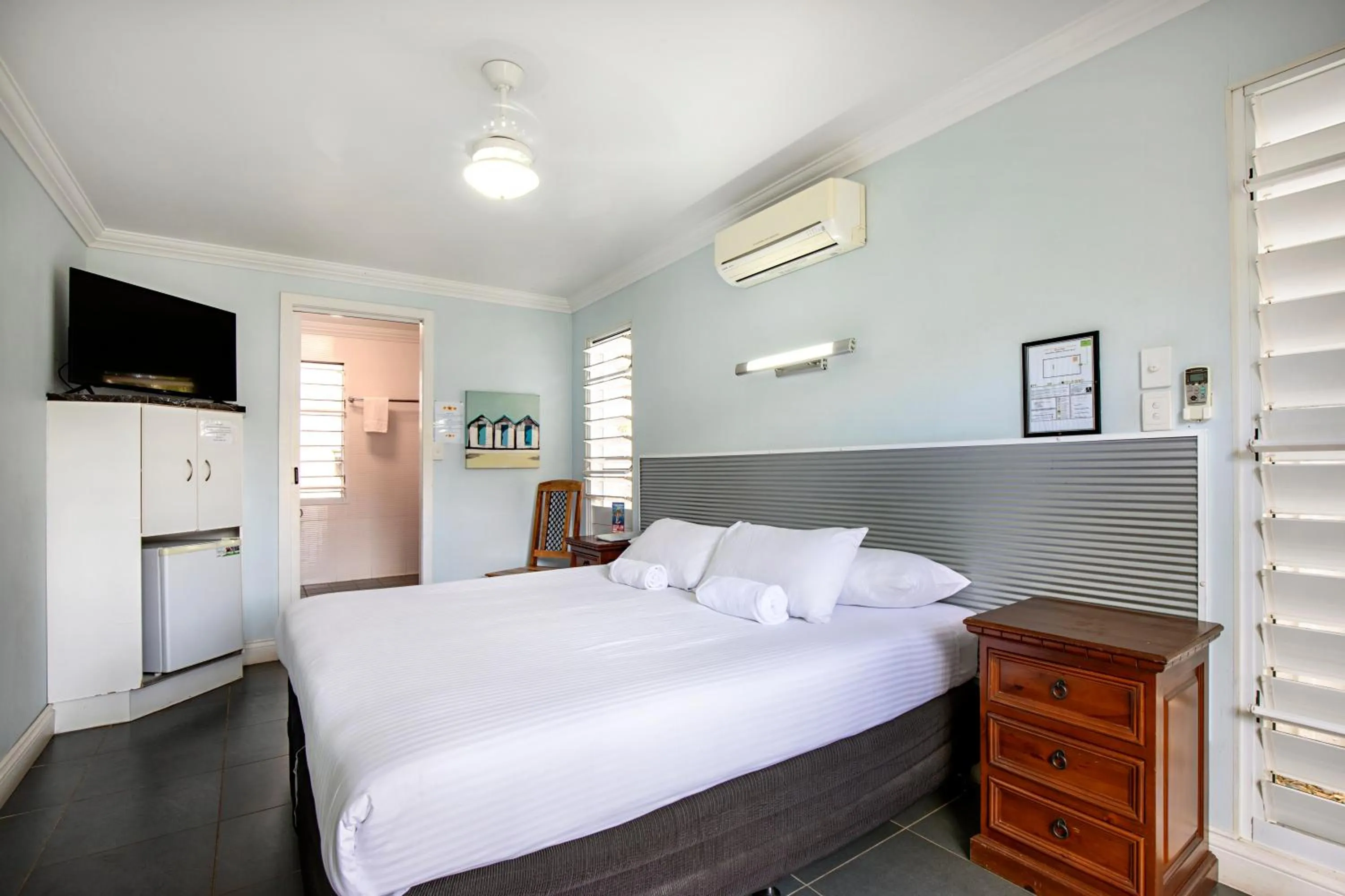 Bed in Bush Village Holiday Cabins