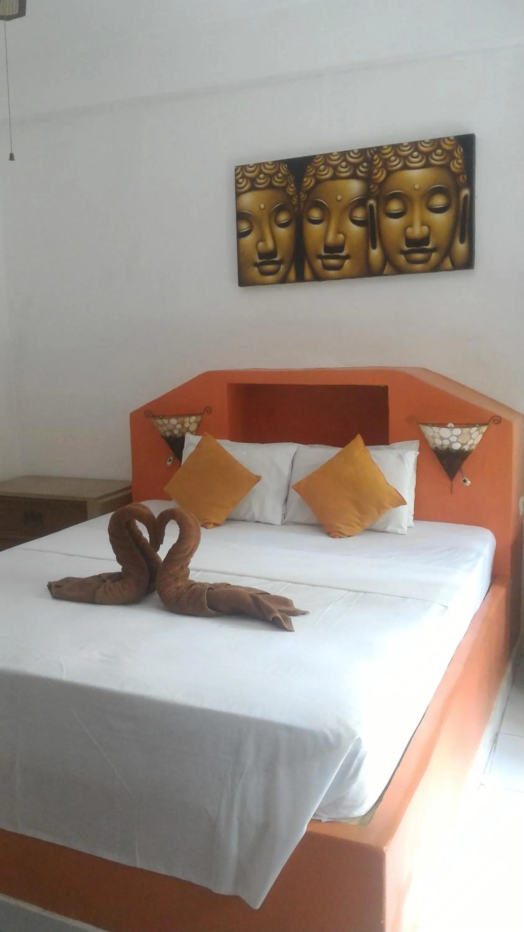 Bed in Puri Oka Beach Bungalows