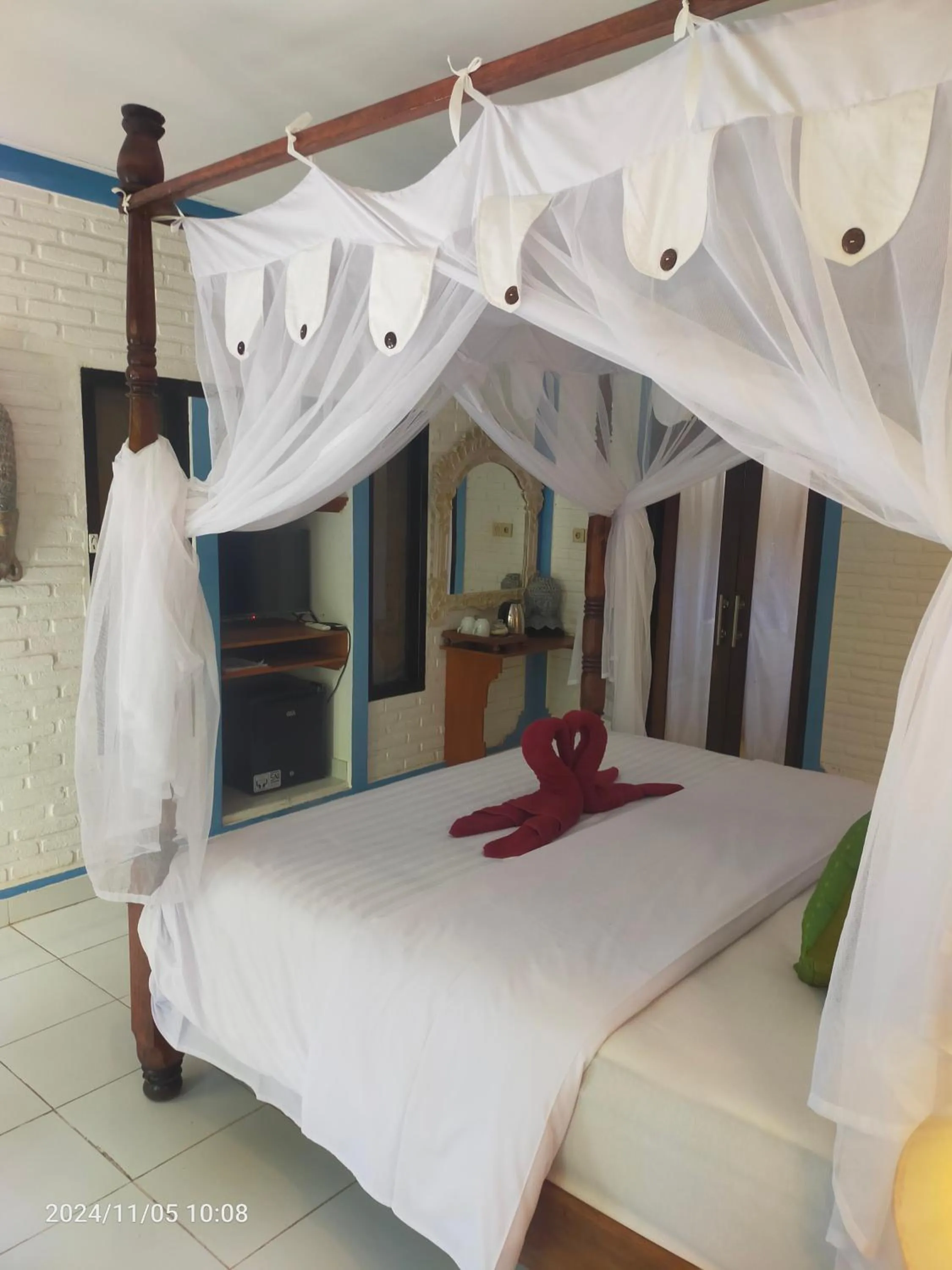 Bed in Puri Oka Beach Bungalows