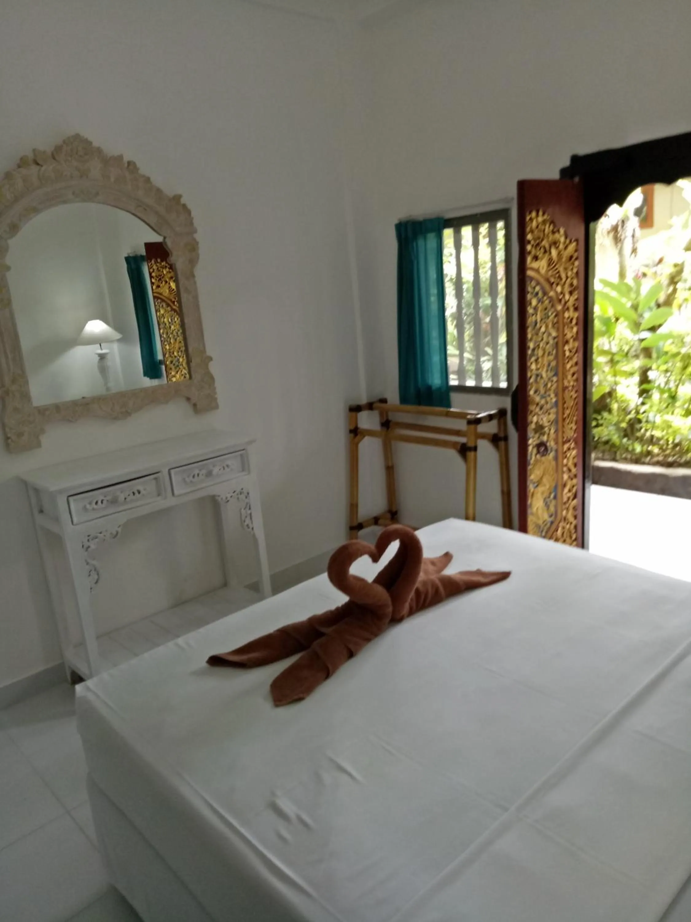 Bed in Puri Oka Beach Bungalows