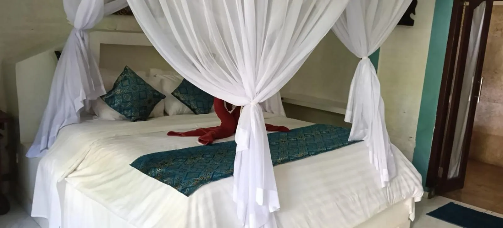 Bed in Puri Oka Beach Bungalows