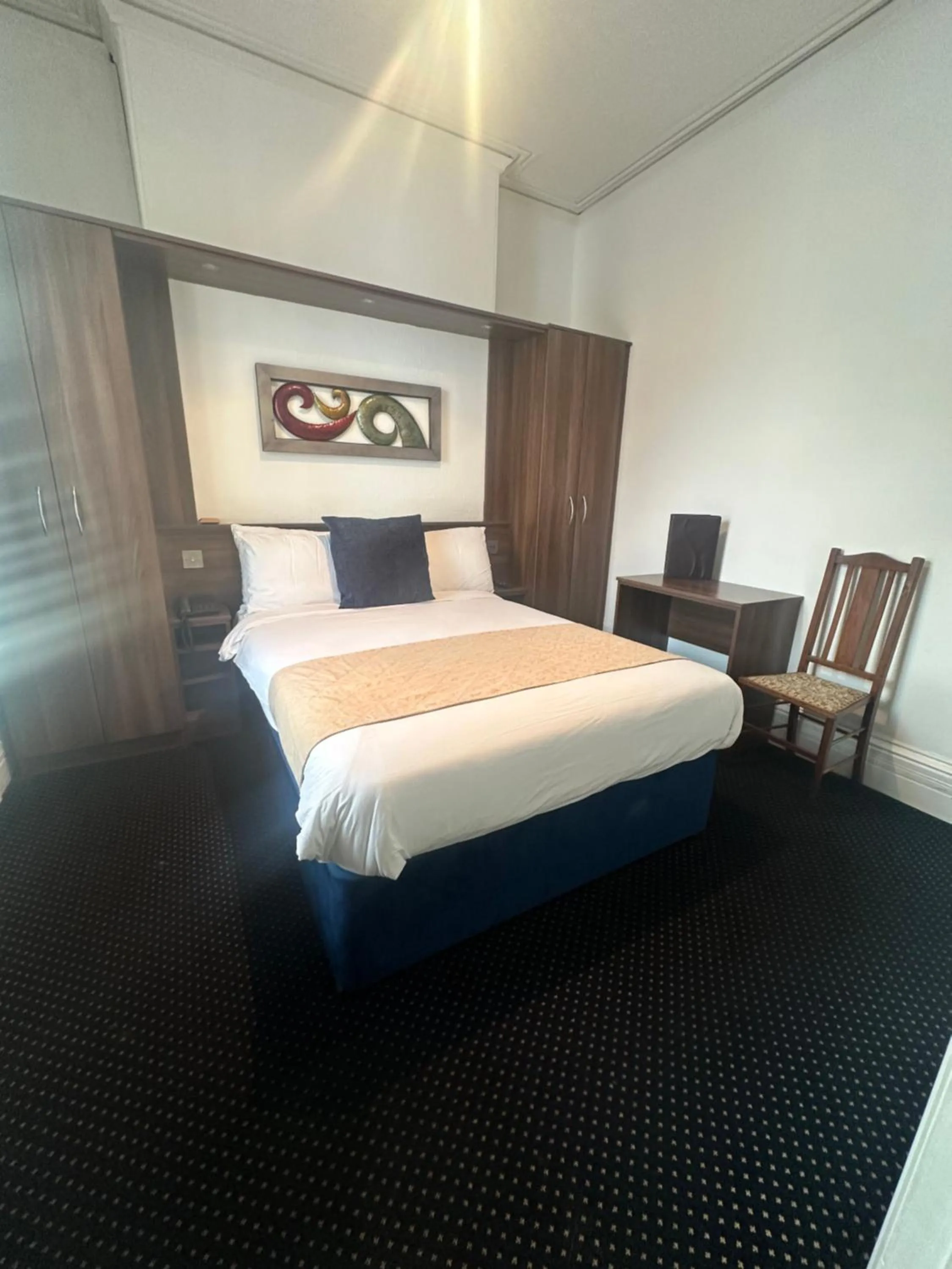 Bed in The Tudor Hotel