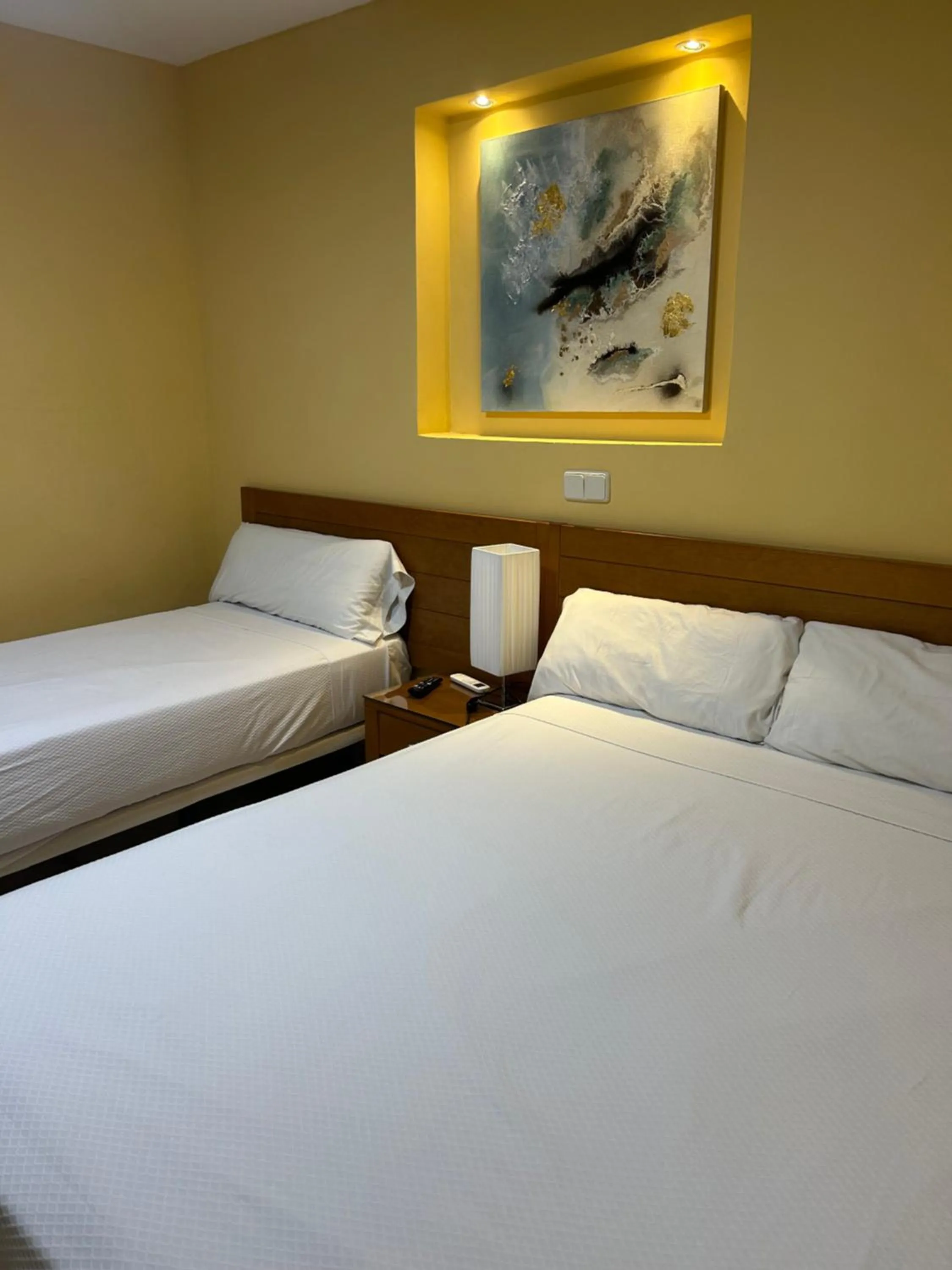 Bed in Hostal Aeropuerto