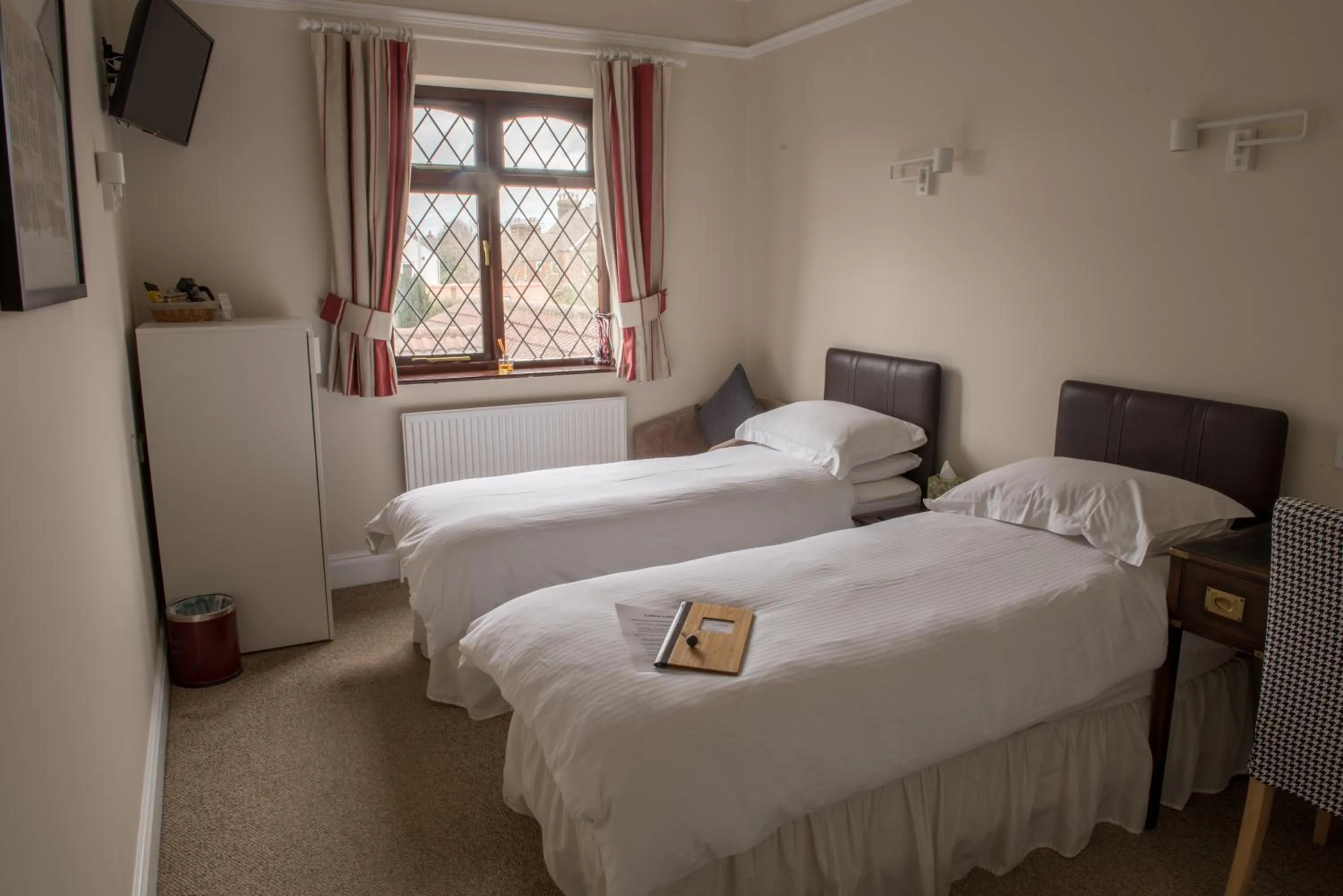 Bed in Toothbrush Rooms at Lattice Lodge - Guest Kitchen & EV Recharging