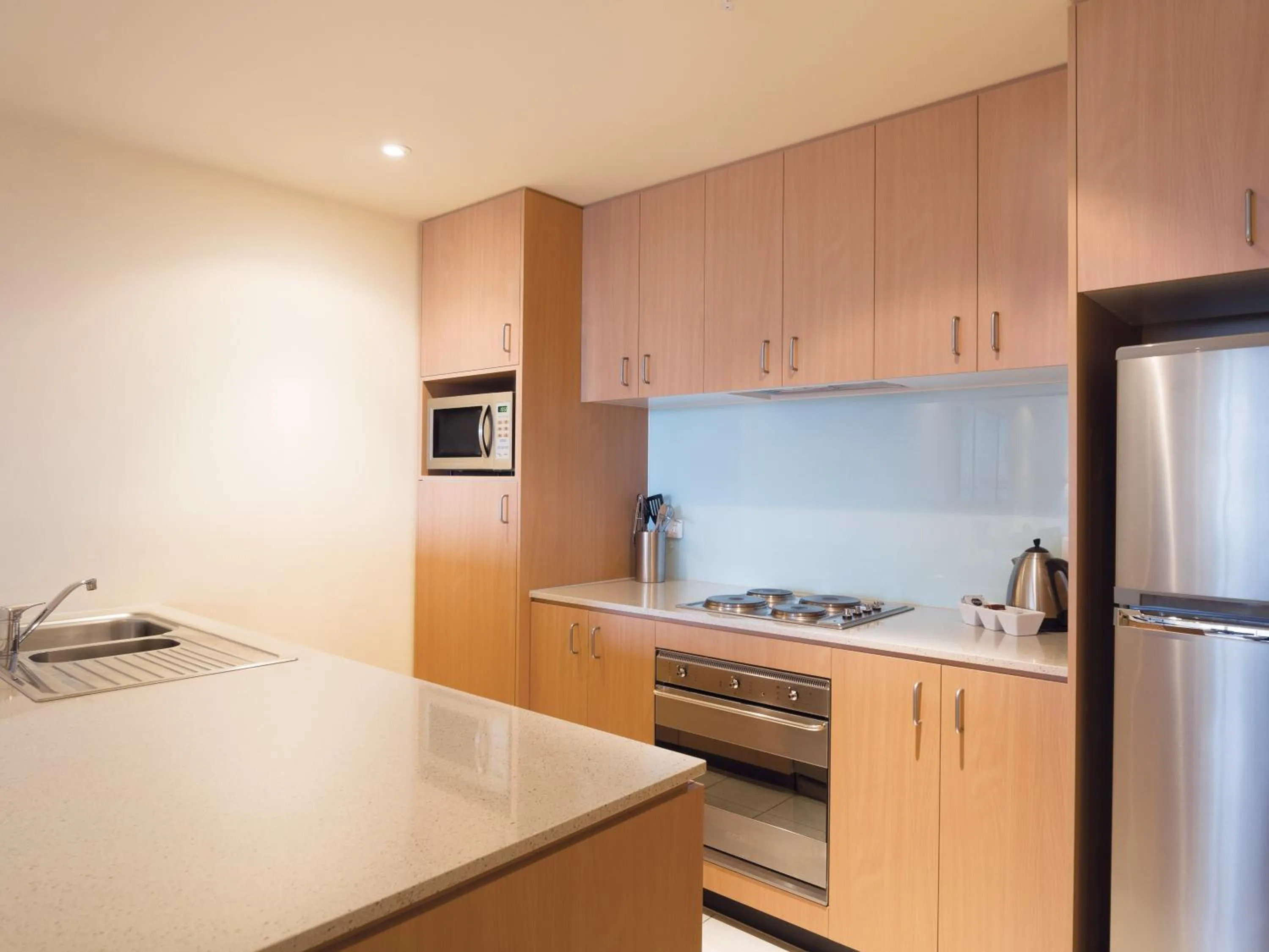 Kitchen or kitchenette in Oaks Melbourne on Lonsdale Suites