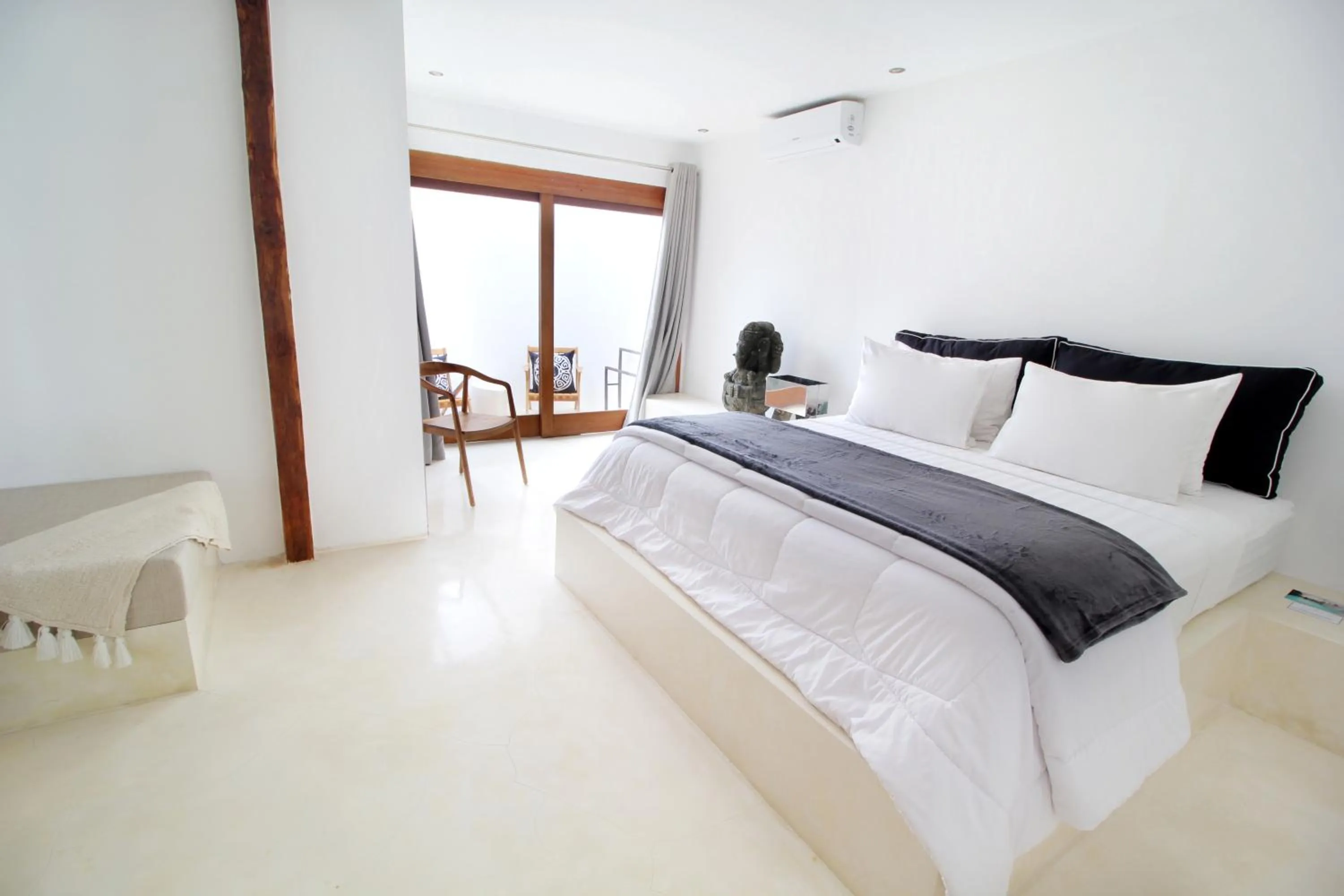 Seating area, Bed in The Apartments Ubud