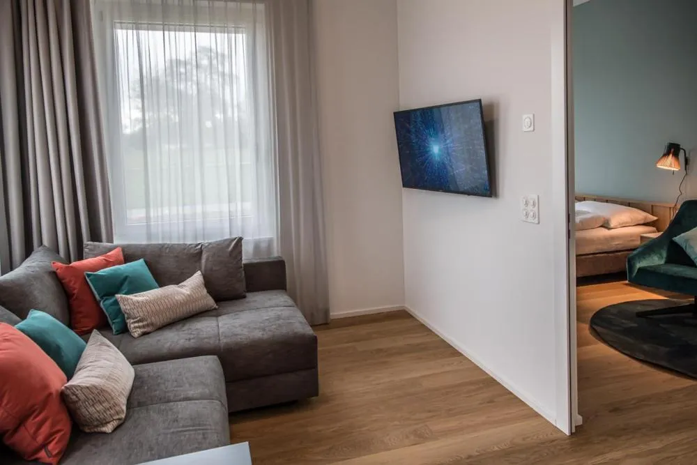 Communal lounge/ TV room in Aparthotel Luzern West